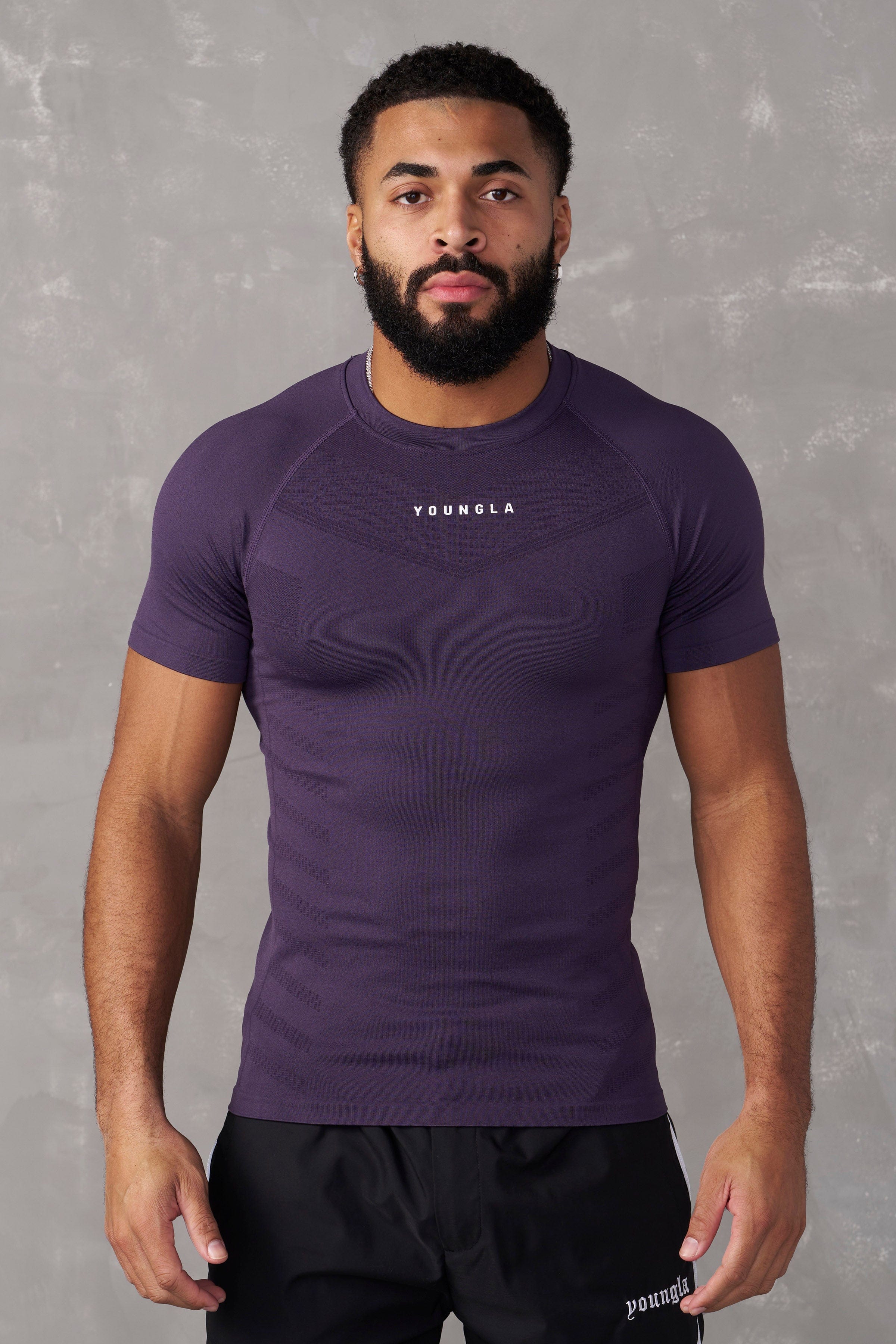 Close-up of fabric texture of SuperVillain fitness compression tees.