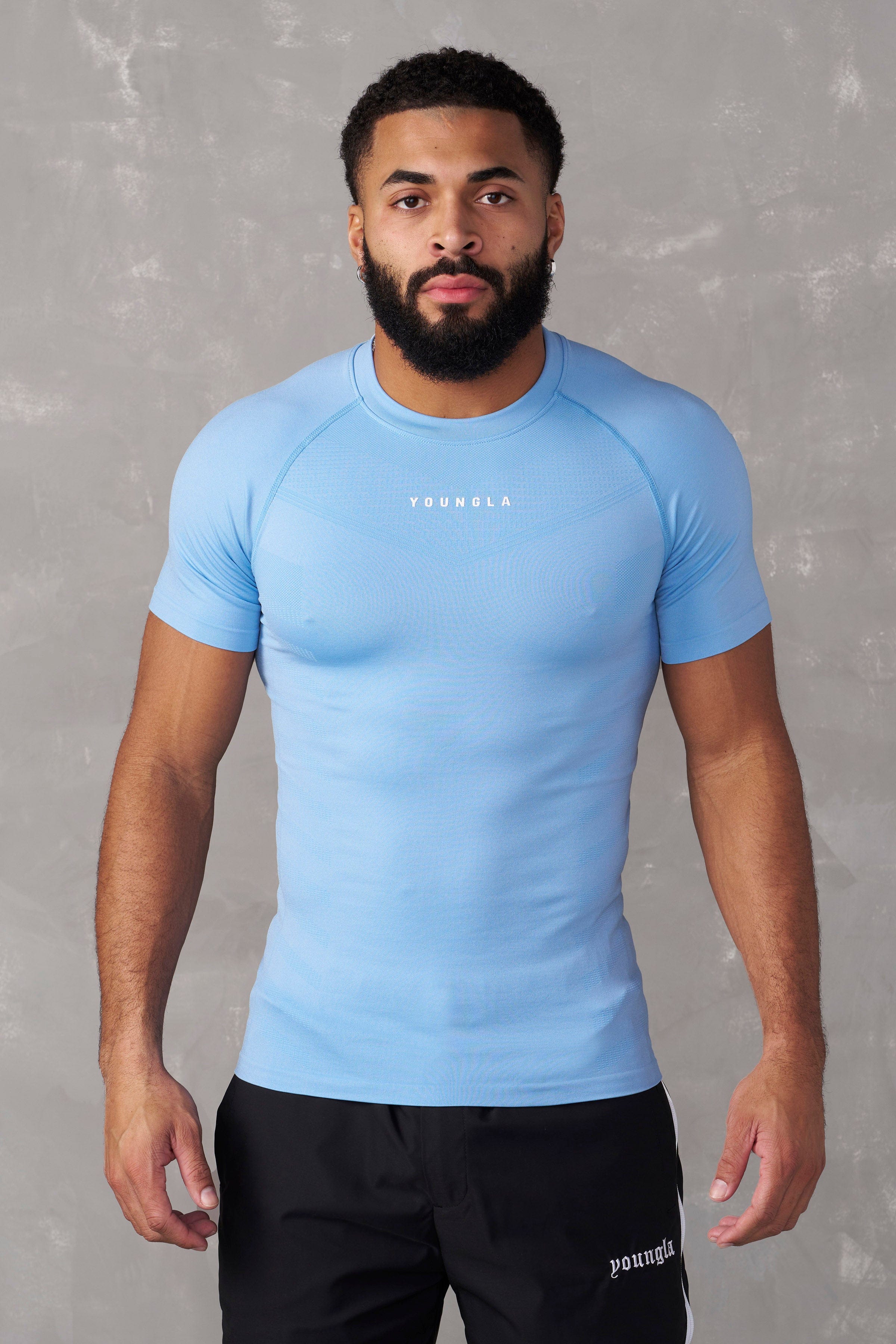 Man jogging outdoors in SuperVillain long sleeve workout shirt.