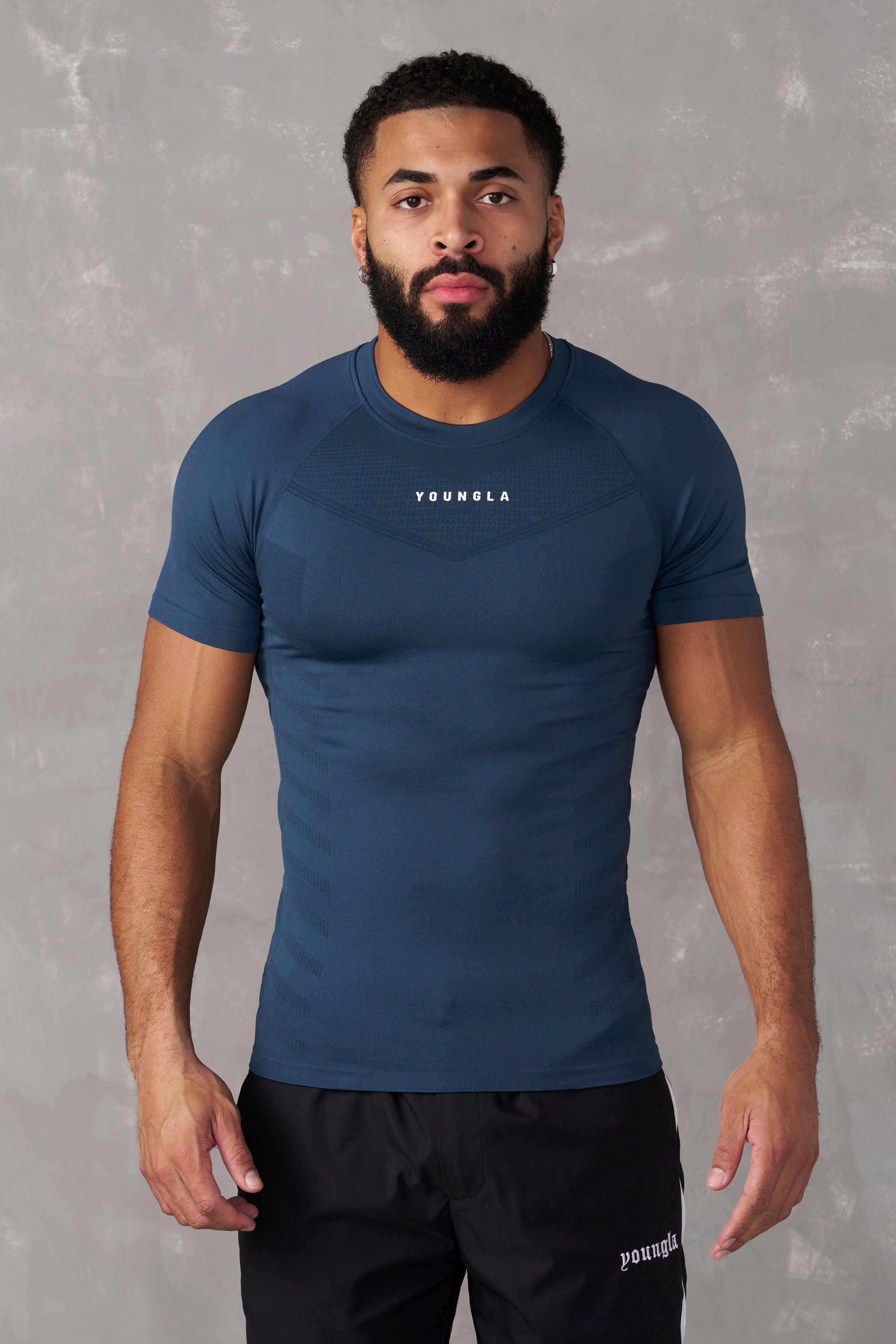 Close-up of fabric texture of SuperVillain fitness compression tees.