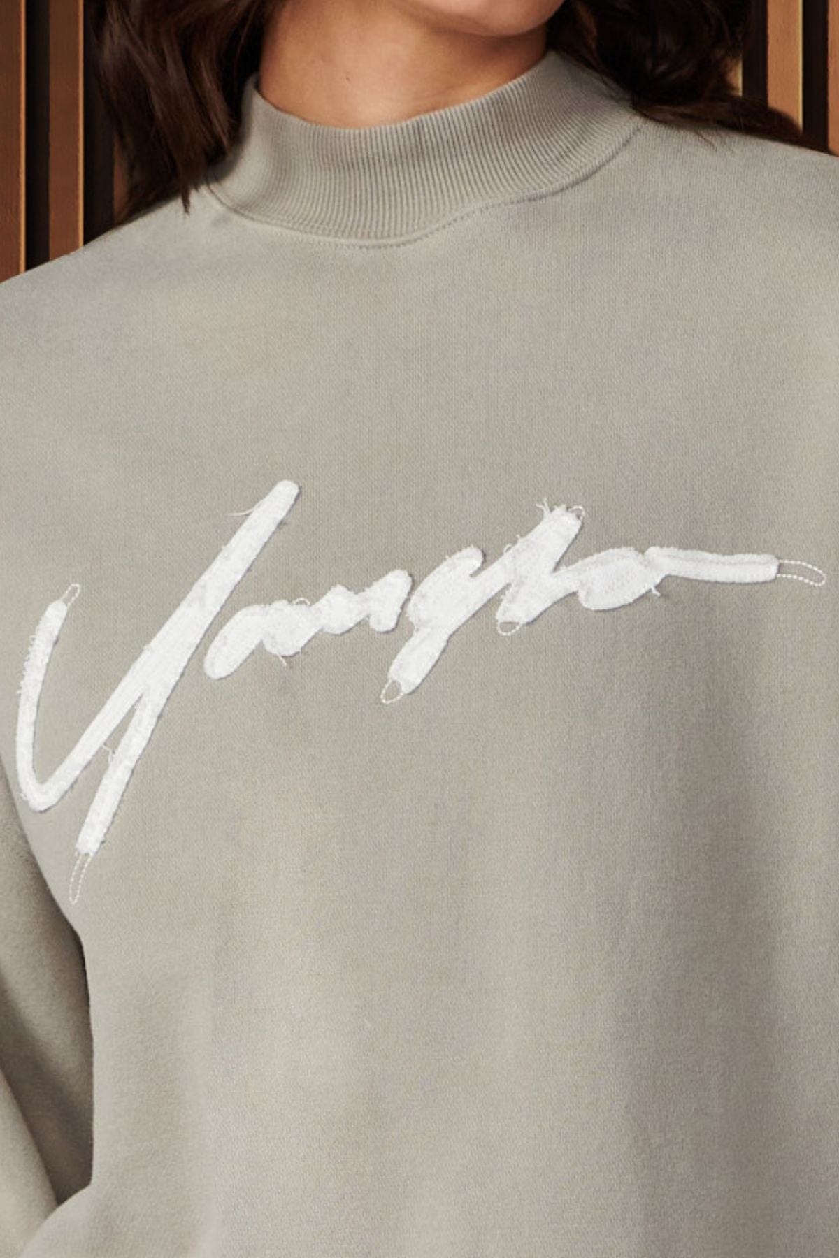Front view of the Urban Crewneck sweatshirt highlighting the bold logo and cozy terry material