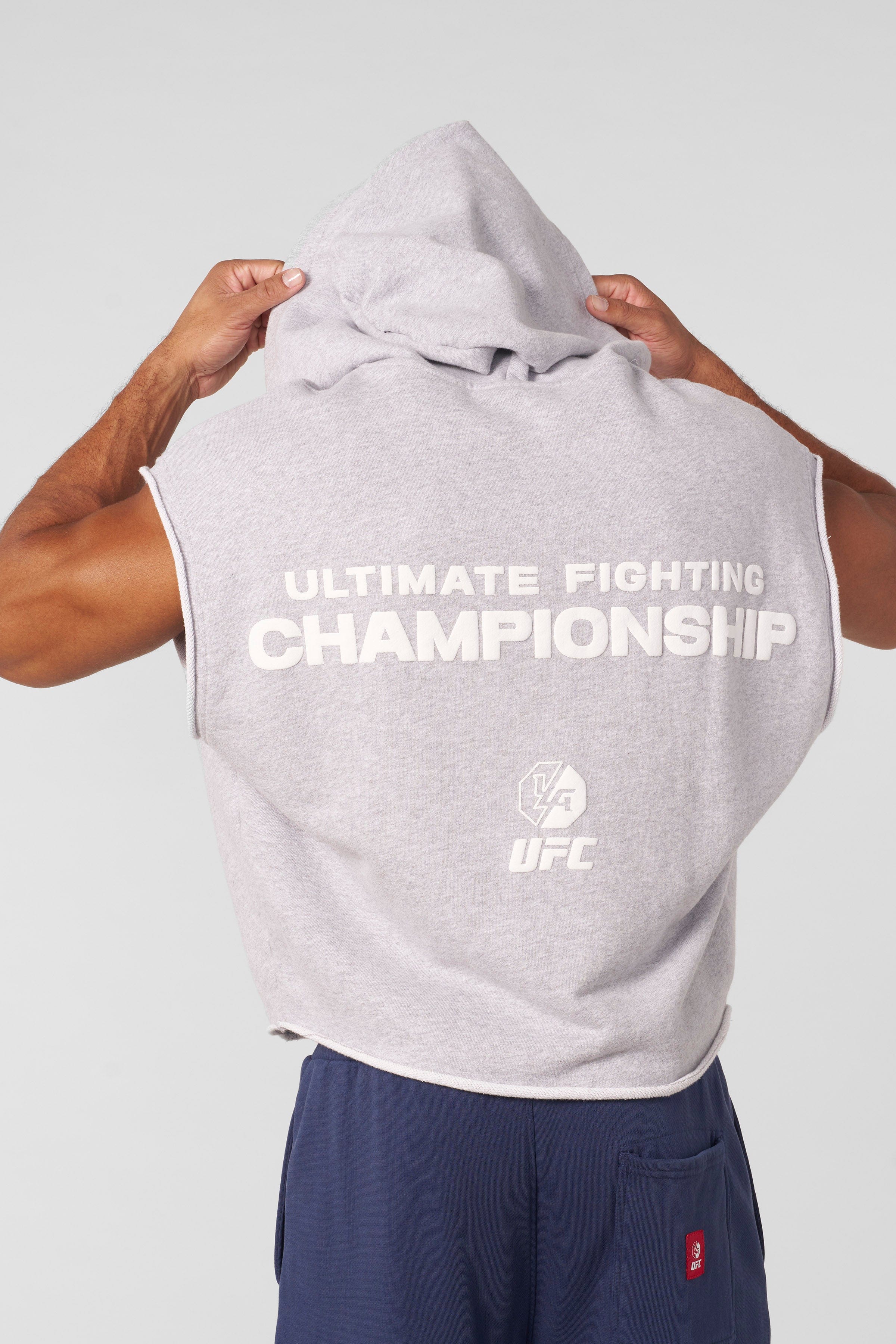 Side angle of the UFC hoodie highlighting sleeveless design.