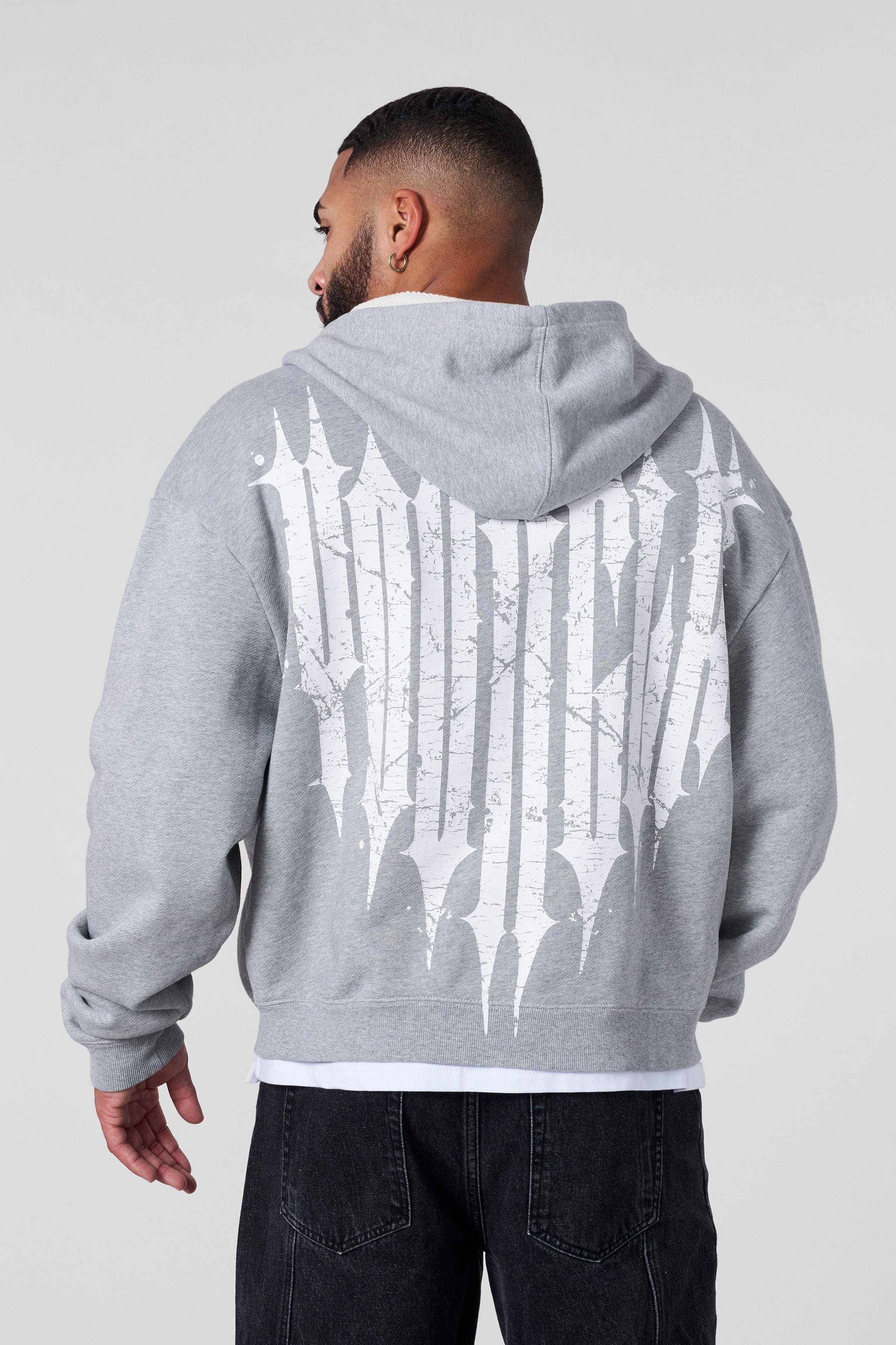 Back view featuring the iconic Revenge logo printed on the black zip-up hoodie