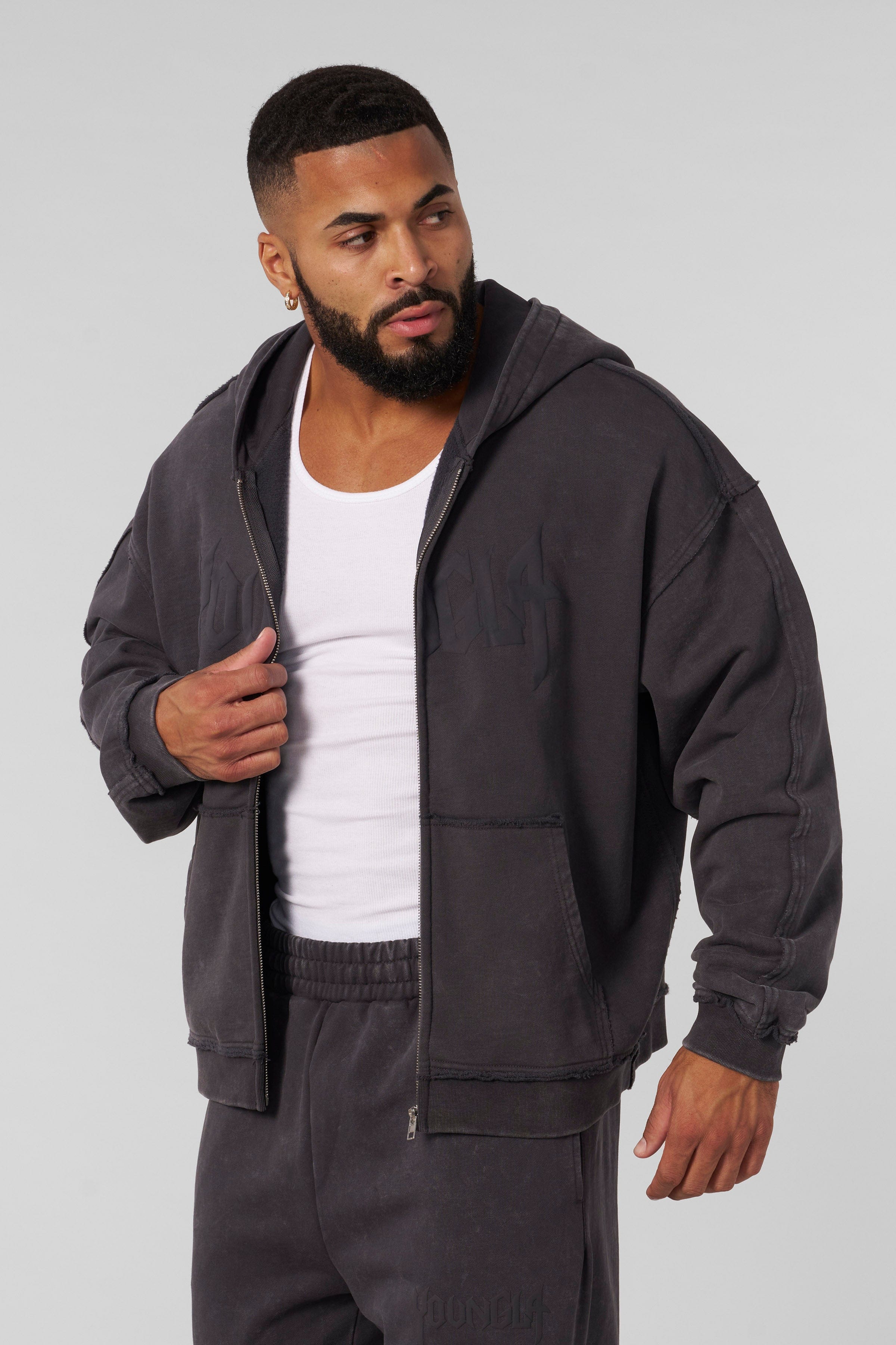 Rear view of comfort hoodie layered over a cotton tee, perfect for travel.