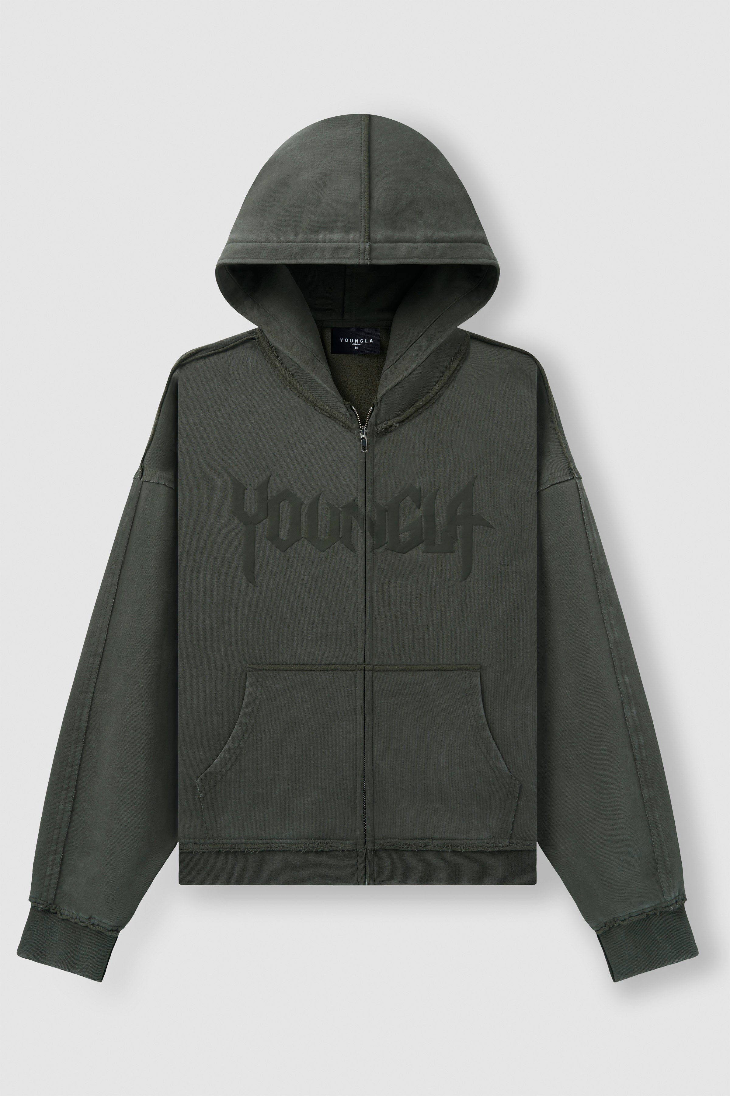 Front angle of black zip up hoodie styled with relaxed jeans.