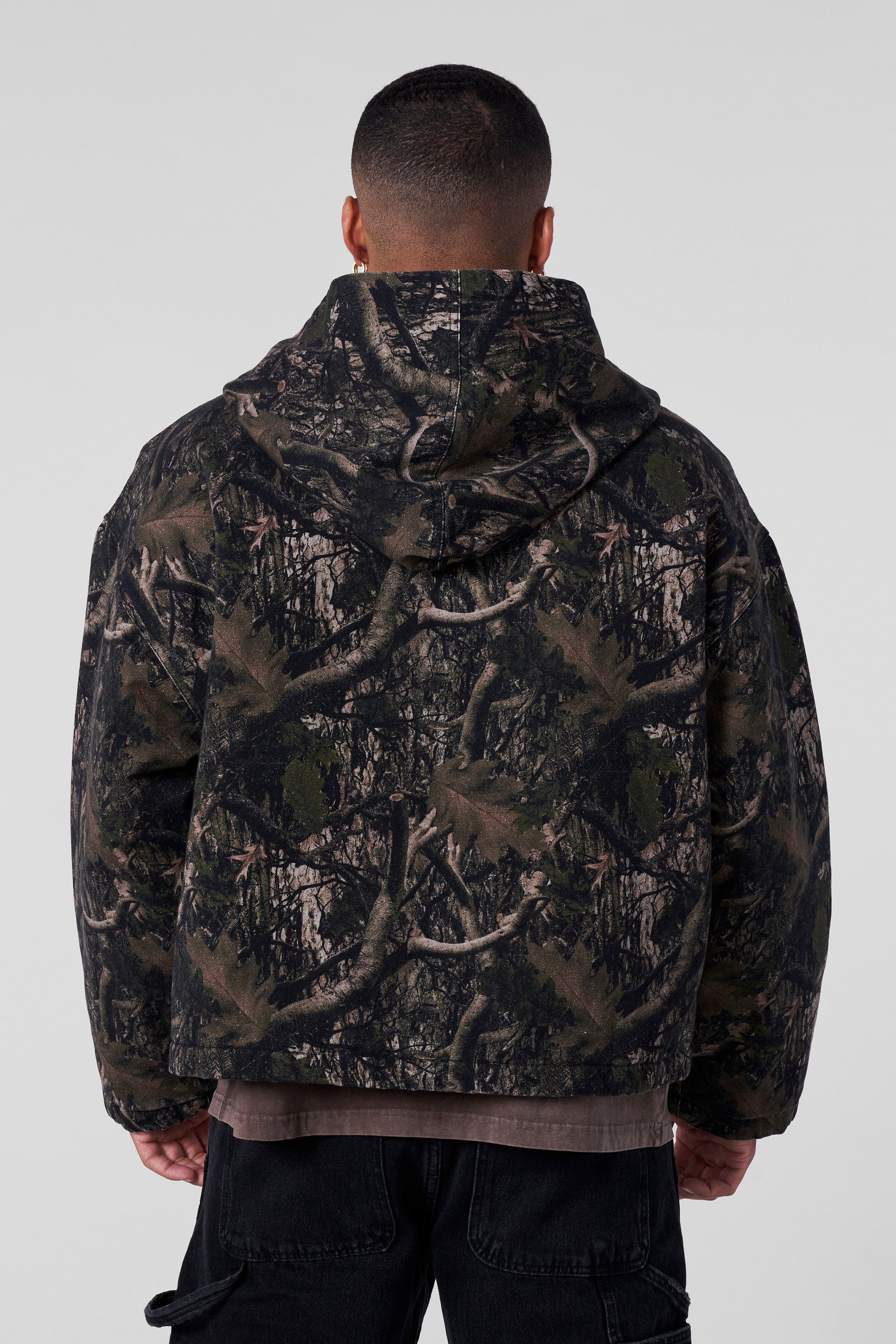 Model wearing the bomber jacket with a neutral background, showcasing fit