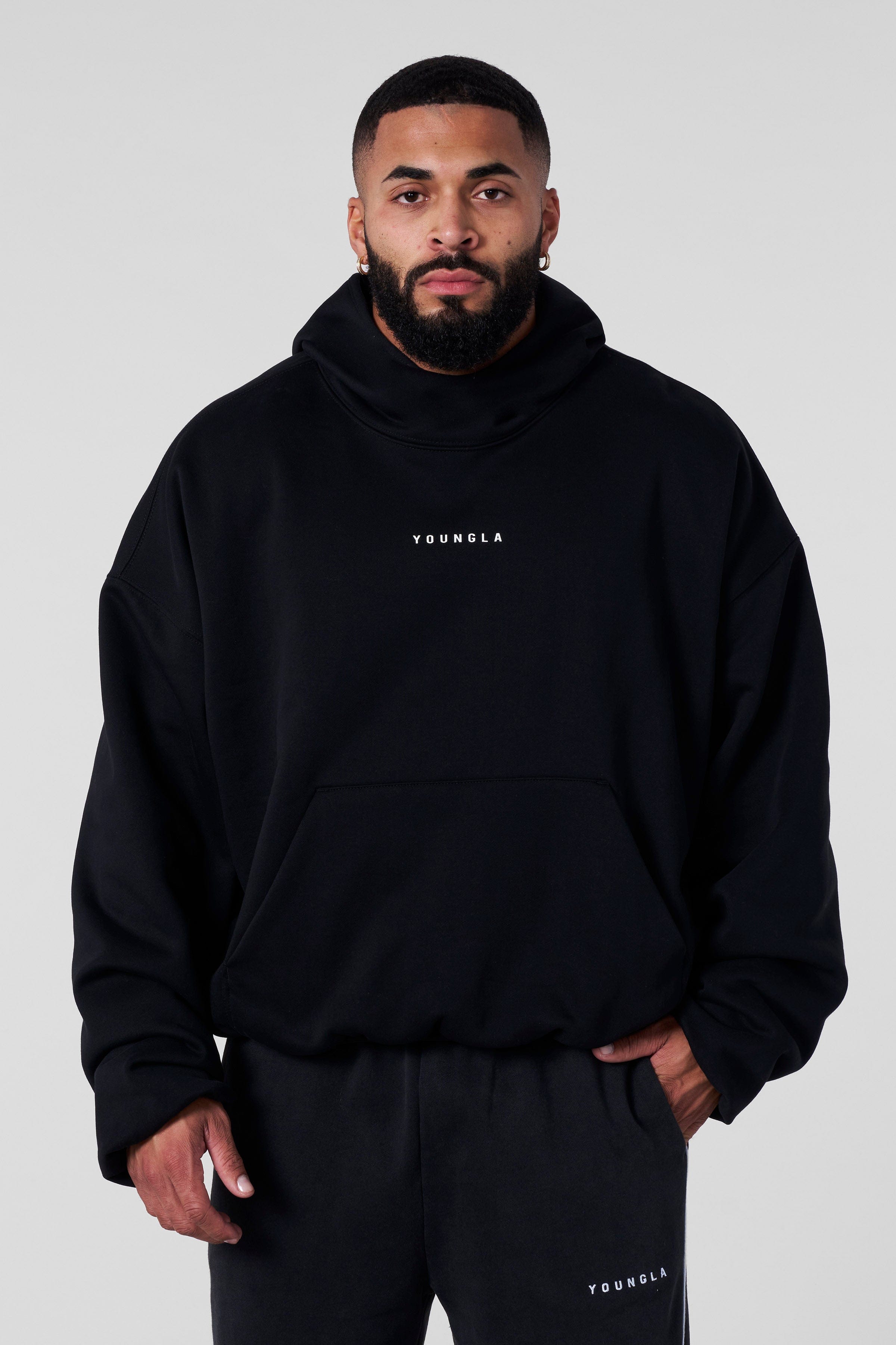 Close-up of minimal logo branding on the SphereFit streetwear hoodie chest