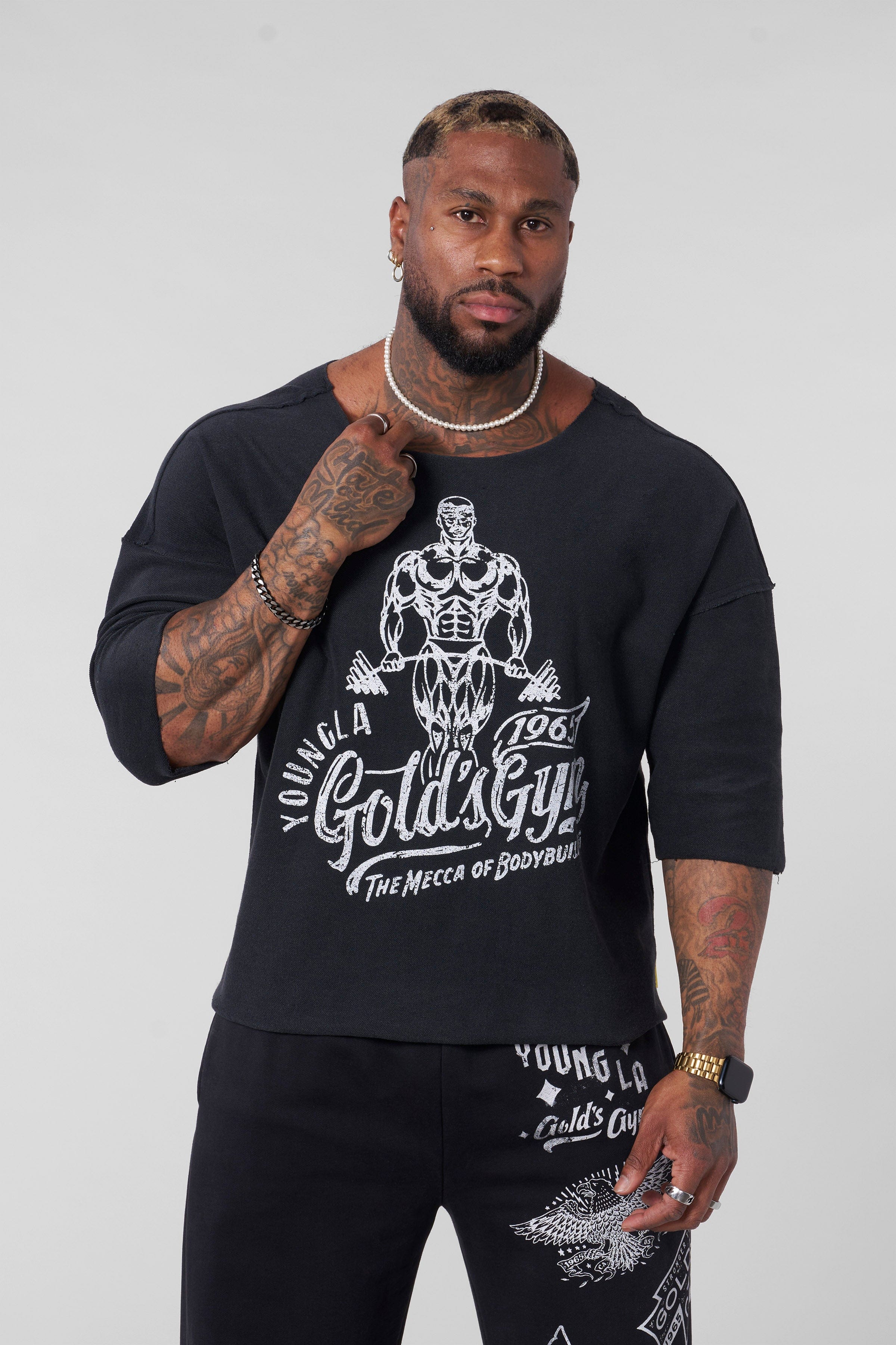 Front view of Golds Gym Vintage Wide Neck Tee, showcasing its relaxed fit.