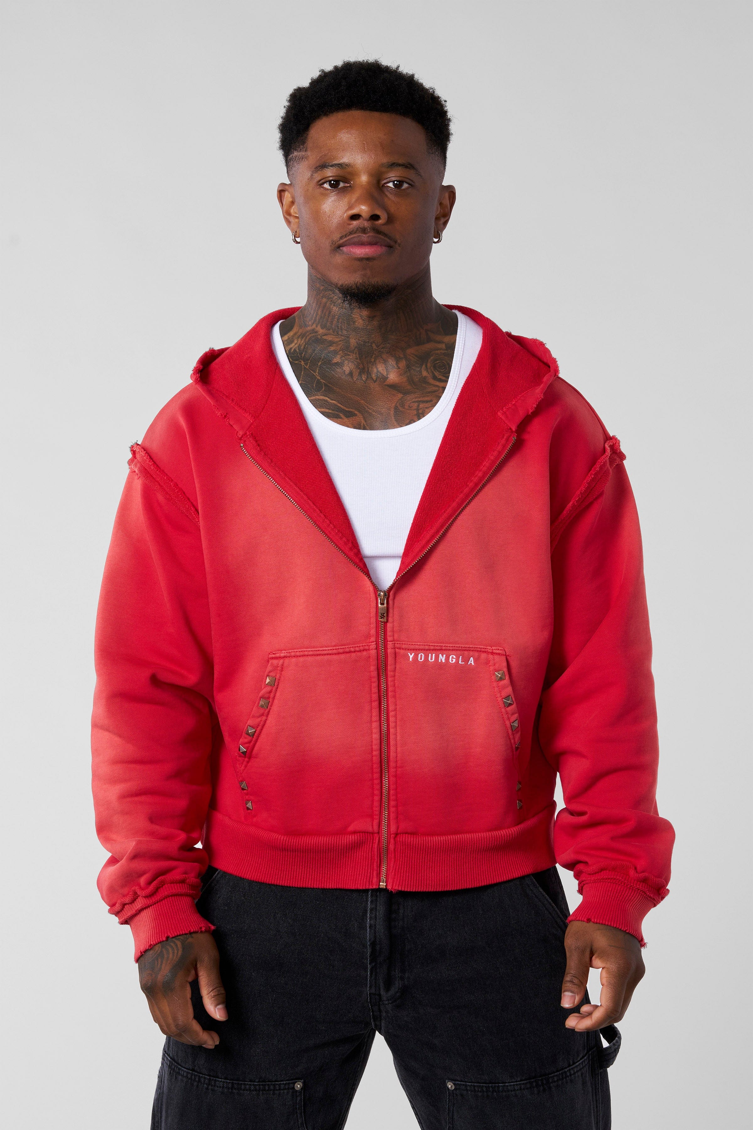 Model showcasing the boxy fit and short length of the deconstructed terry hoodie
