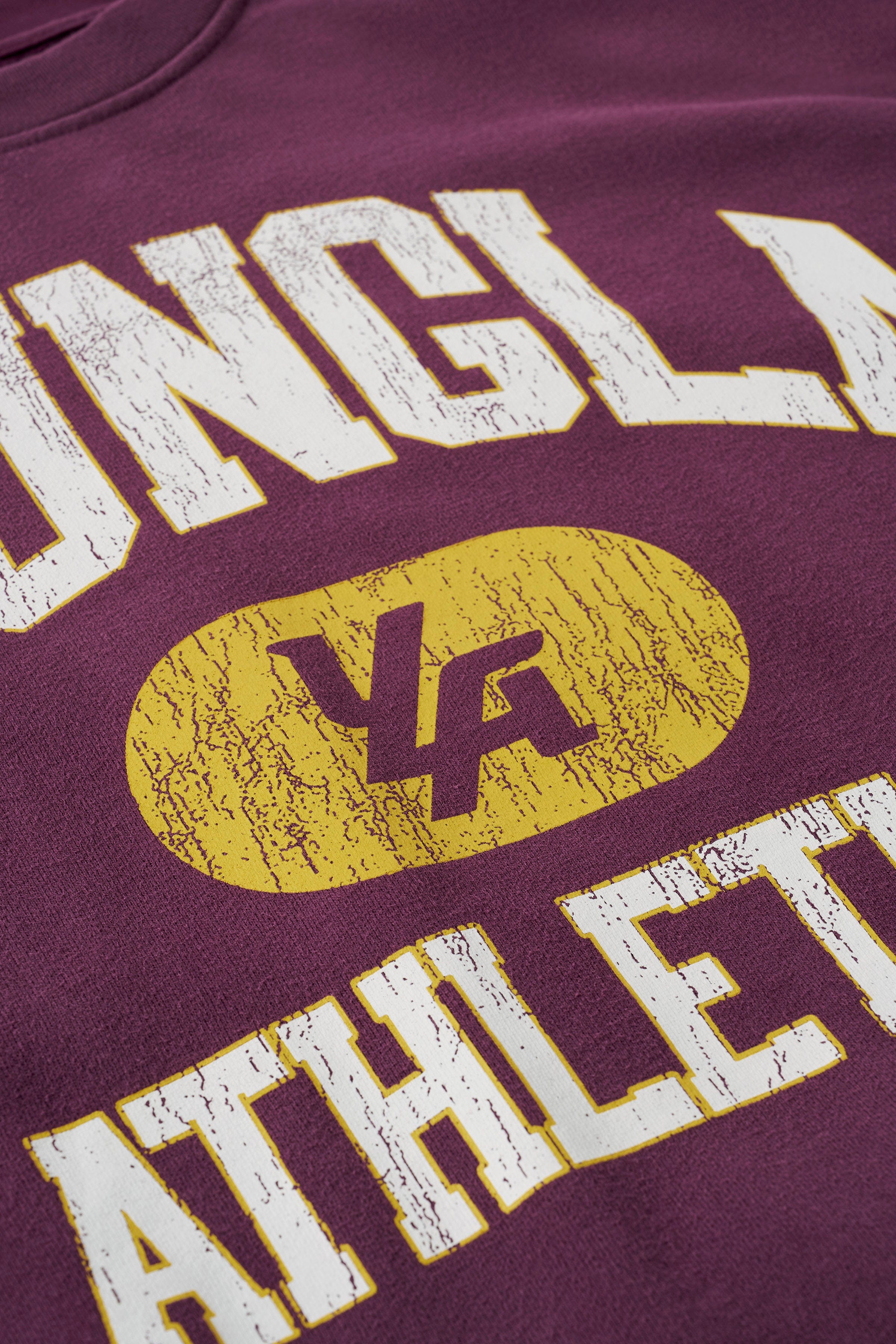 Back view of vintage sweatshirt with relaxed oversized clothing fit worn on city sidewalk