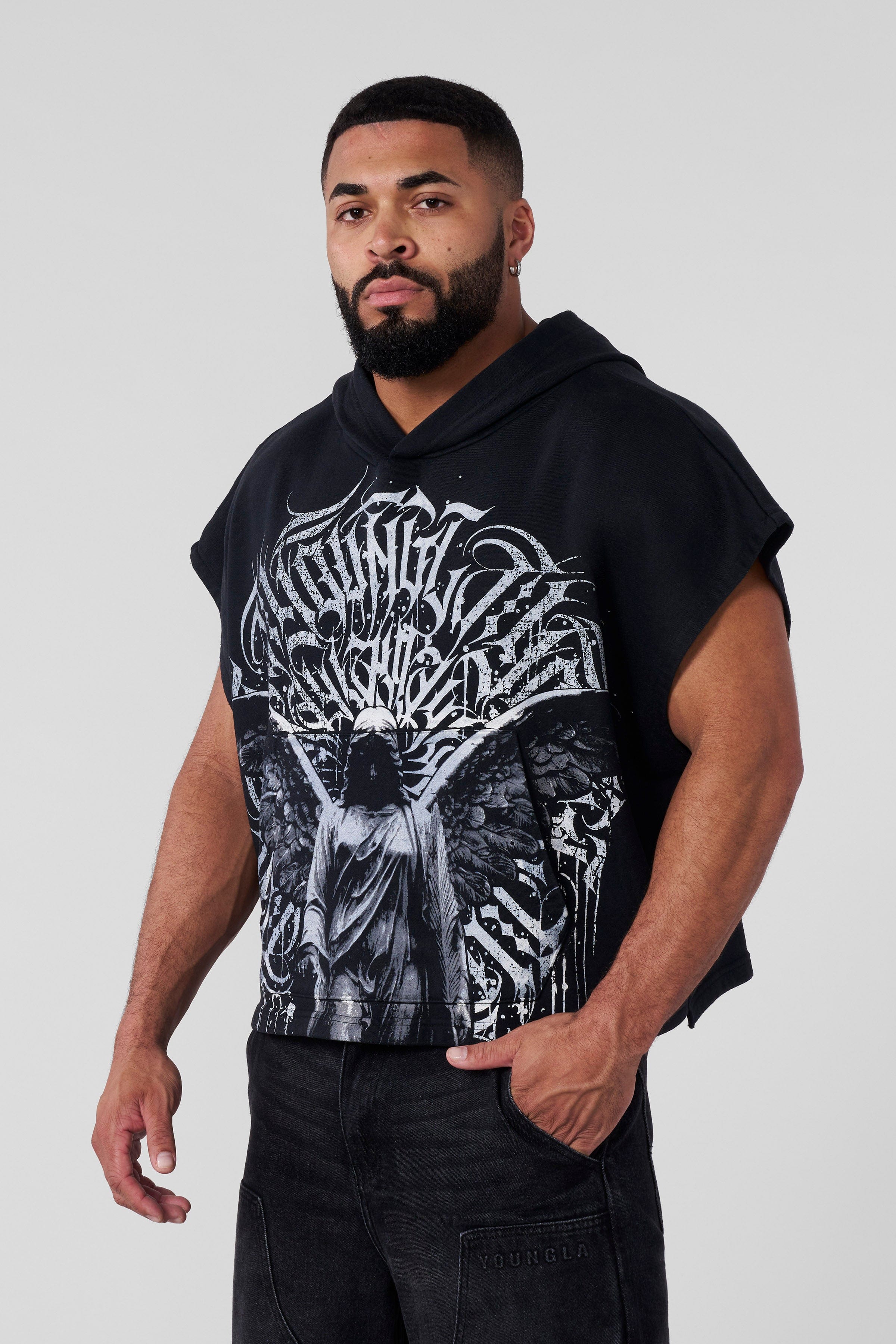 Close-up of gothic graphic on cut-off hoodie