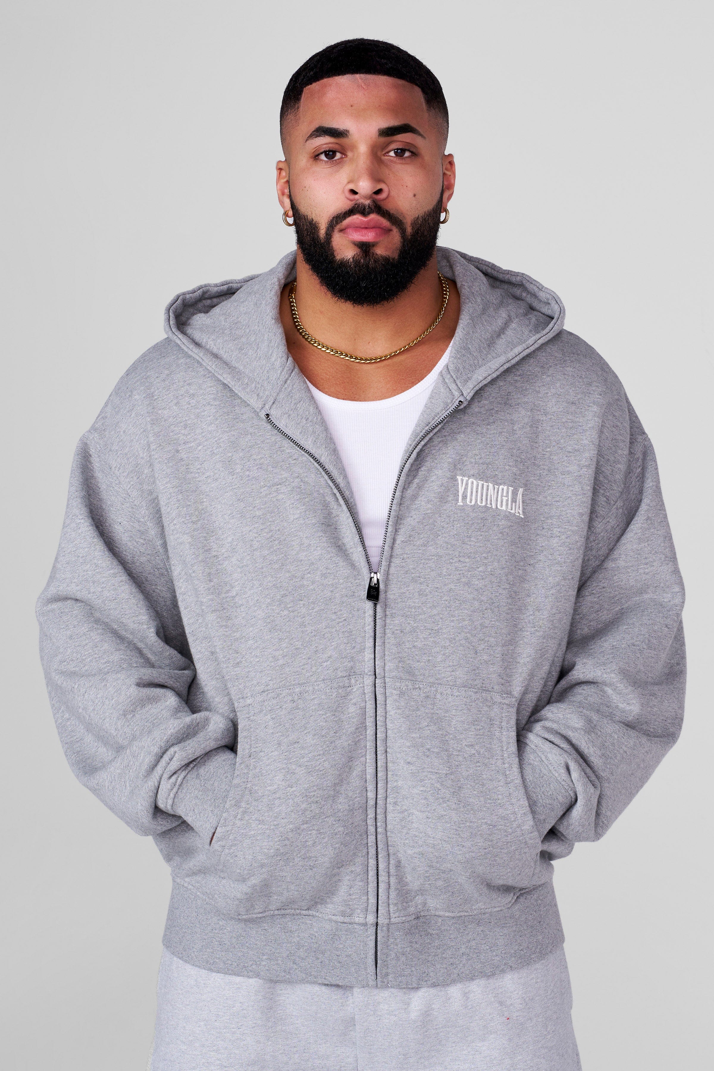 Side view of the black zip-up hoodie, perfect for casual outings.