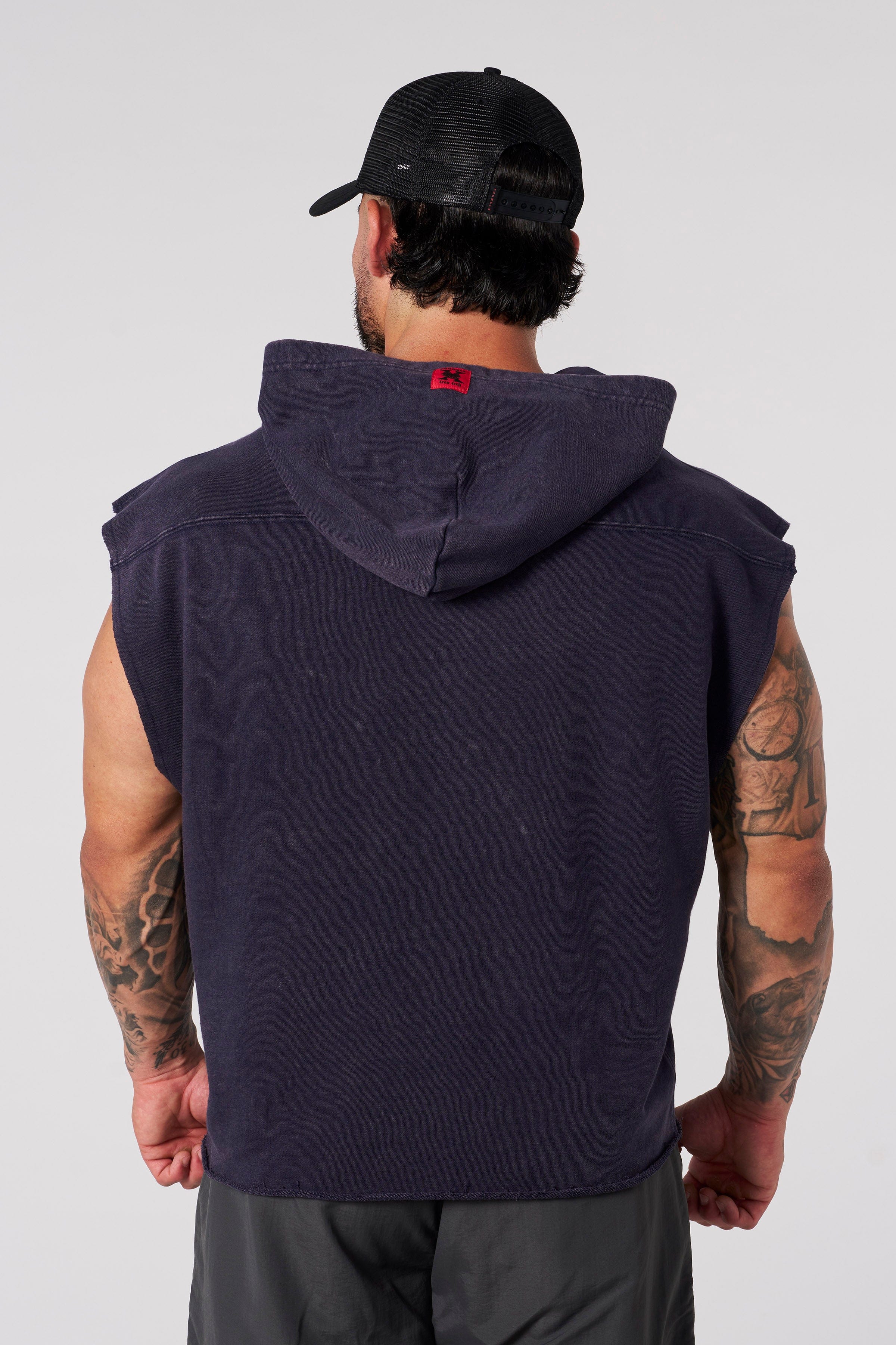 Close-up of Tren Twins hoodies barking dogs graphic and V-neck