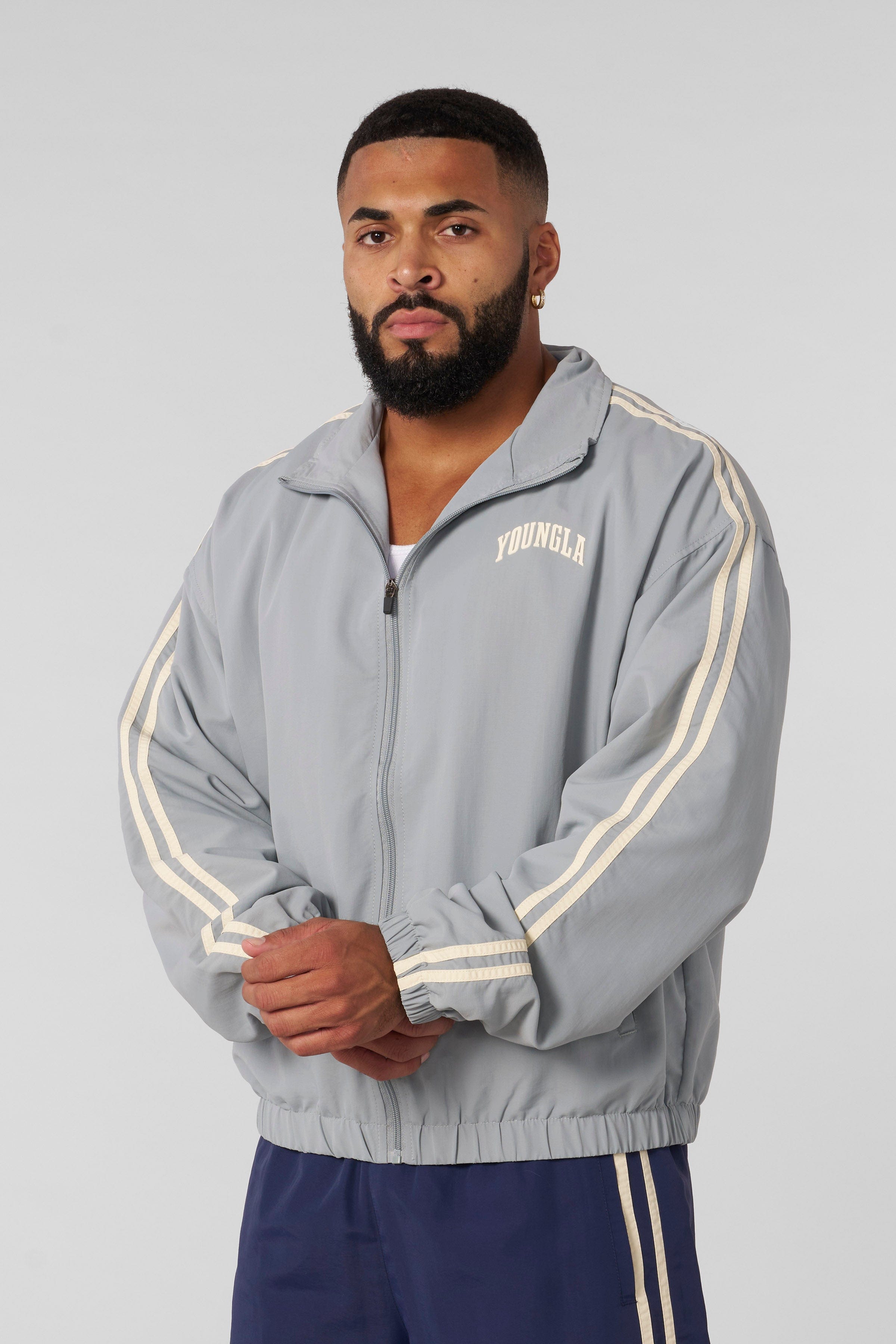 Front view of the athletic zip-up jacket for men, showcasing sporty design.