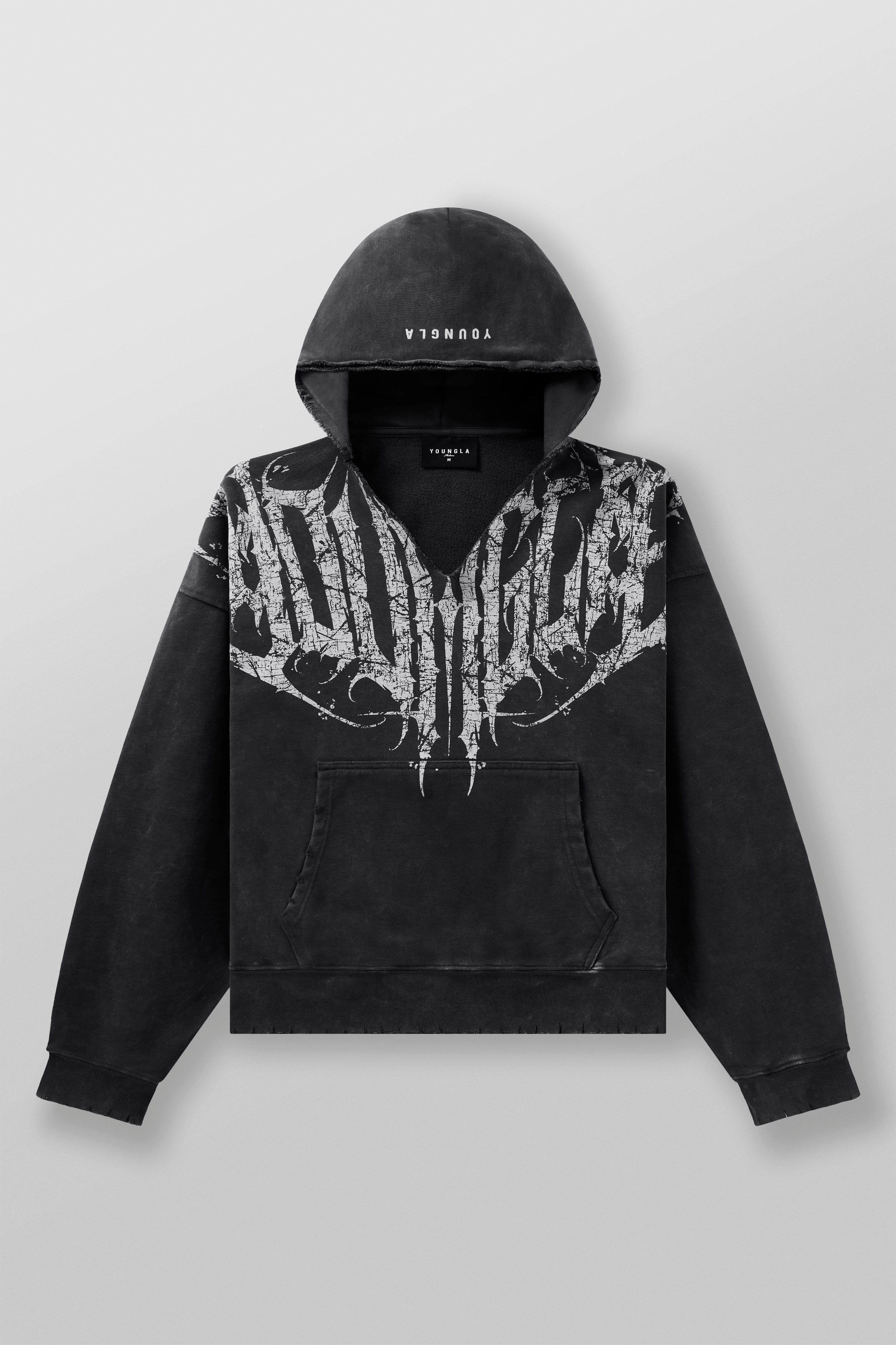 Close-up of raw-cut hood and textured fabric of the distressed hoodie