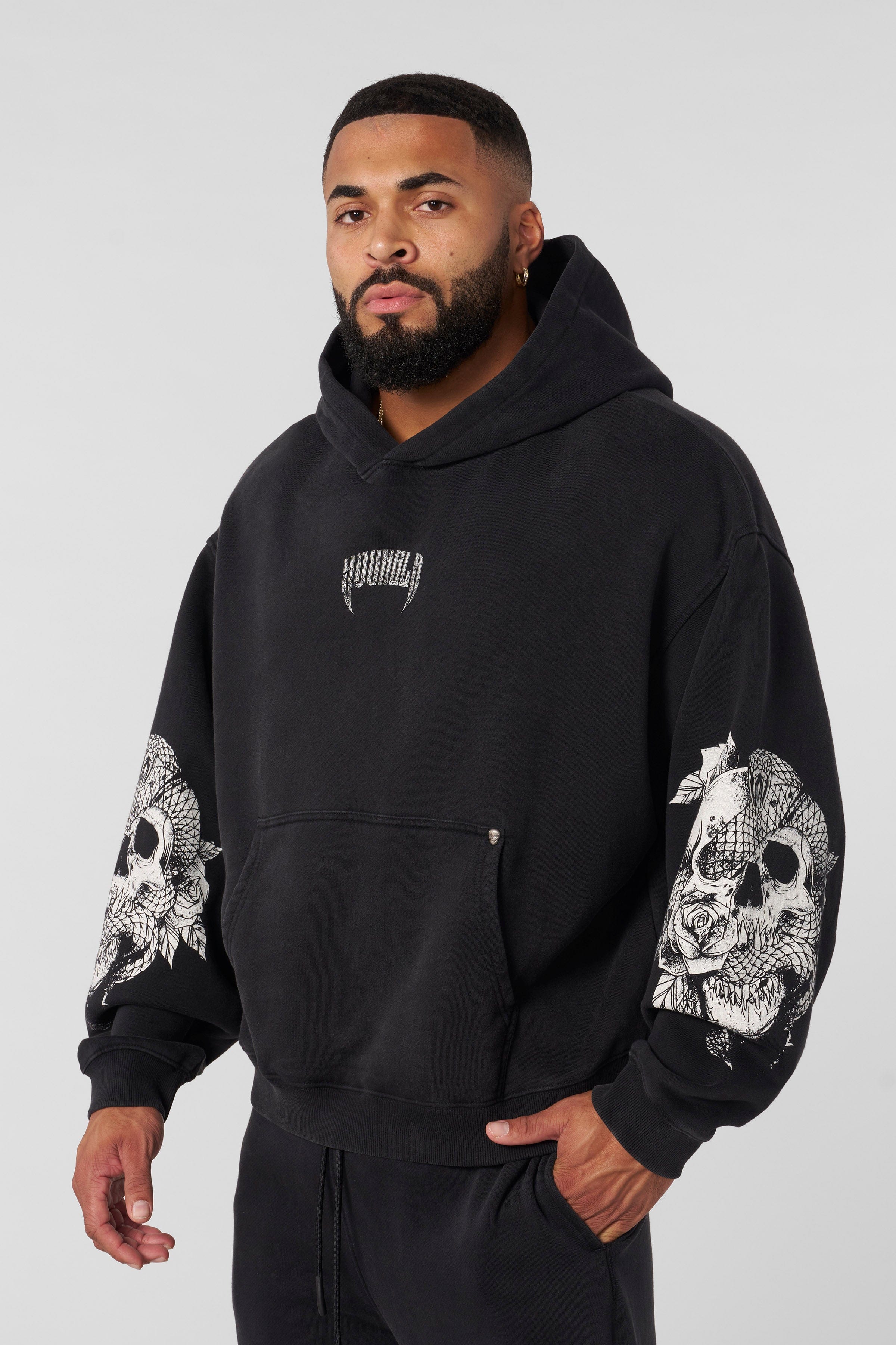 Front view of oversized hoodie men style with skull sleeve design, perfect for fall layering
