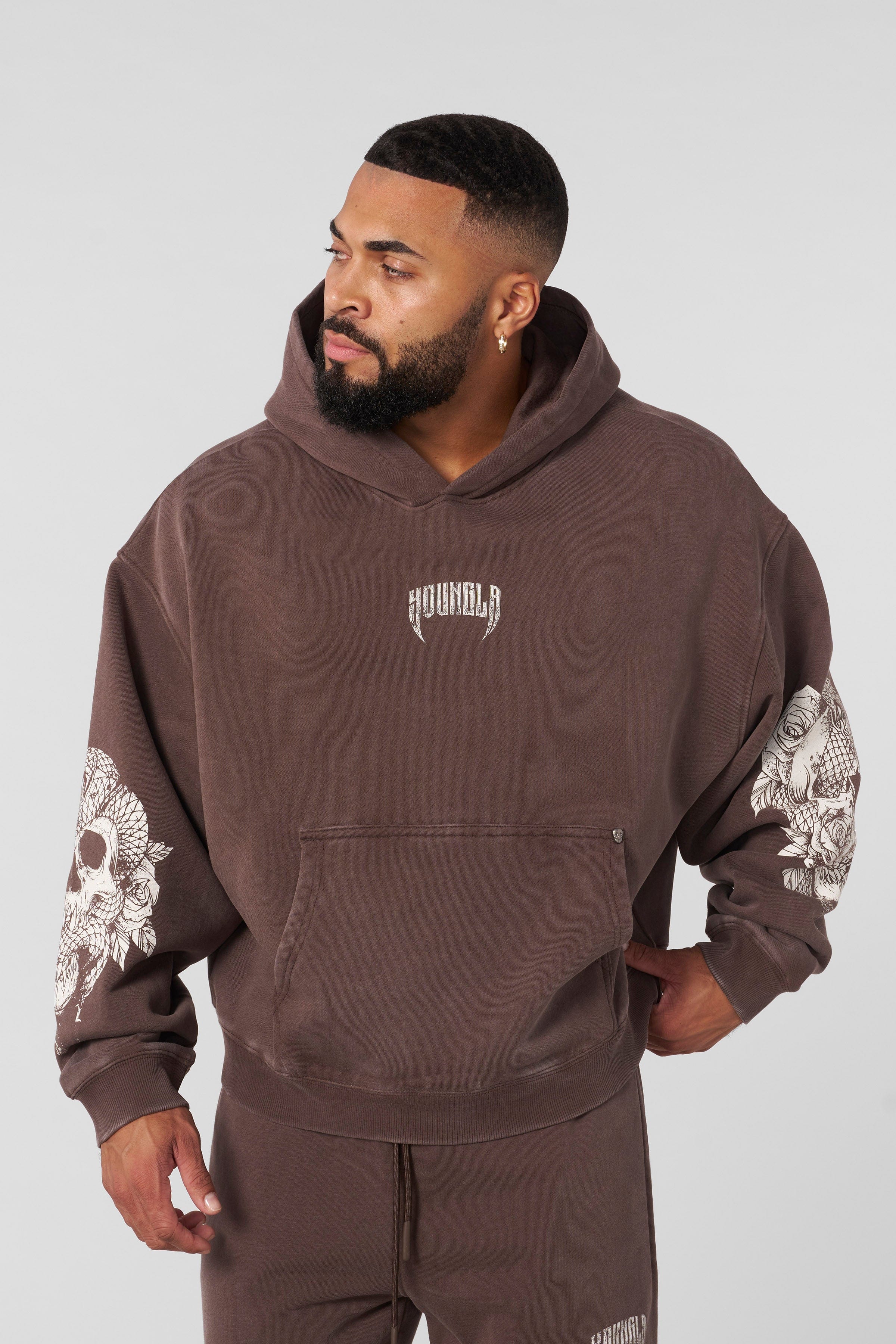 Front view of oversized hoodie men style with skull sleeve design, perfect for fall layering