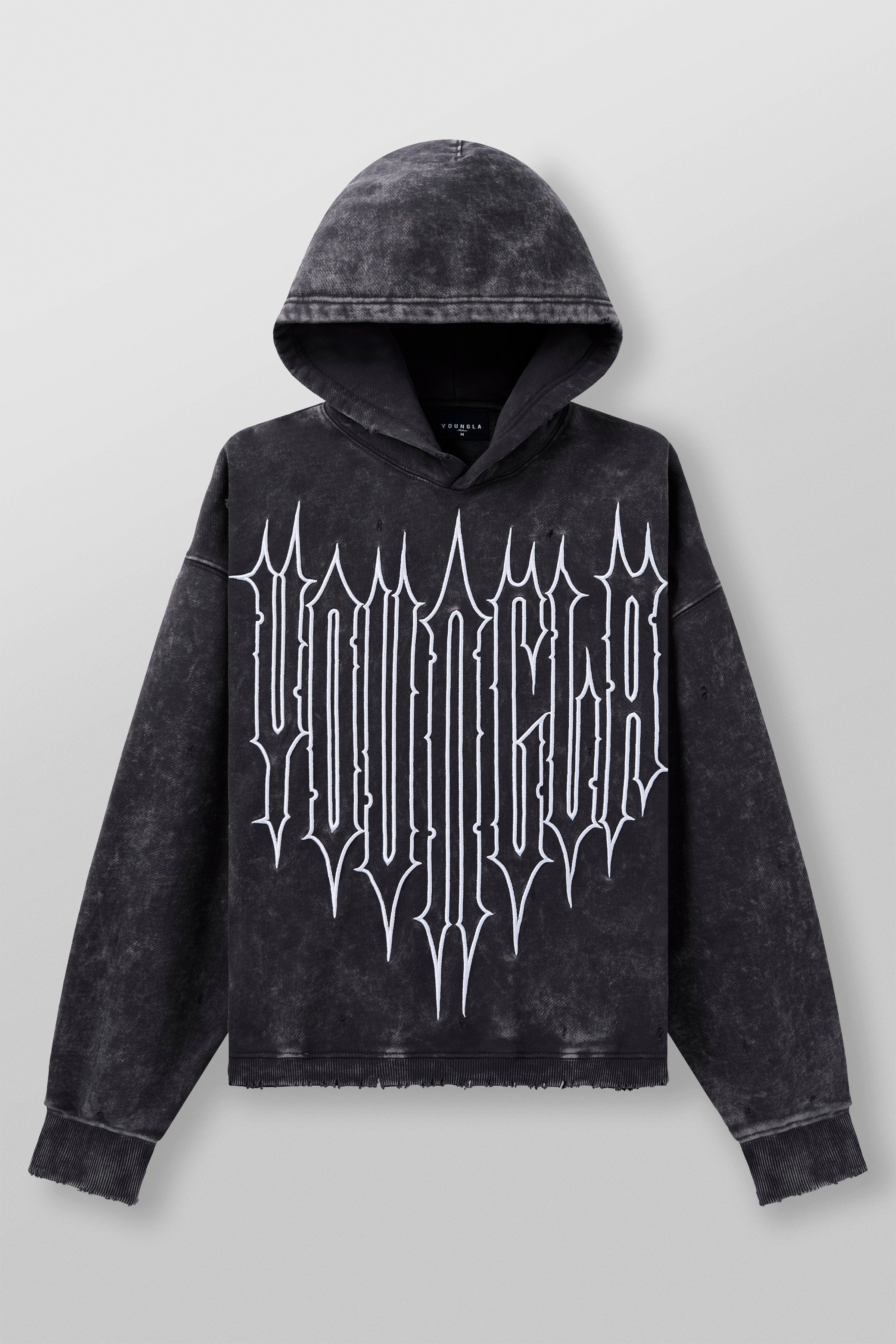 Model in oversized hoodie men’s fit showing cuff and waistband details