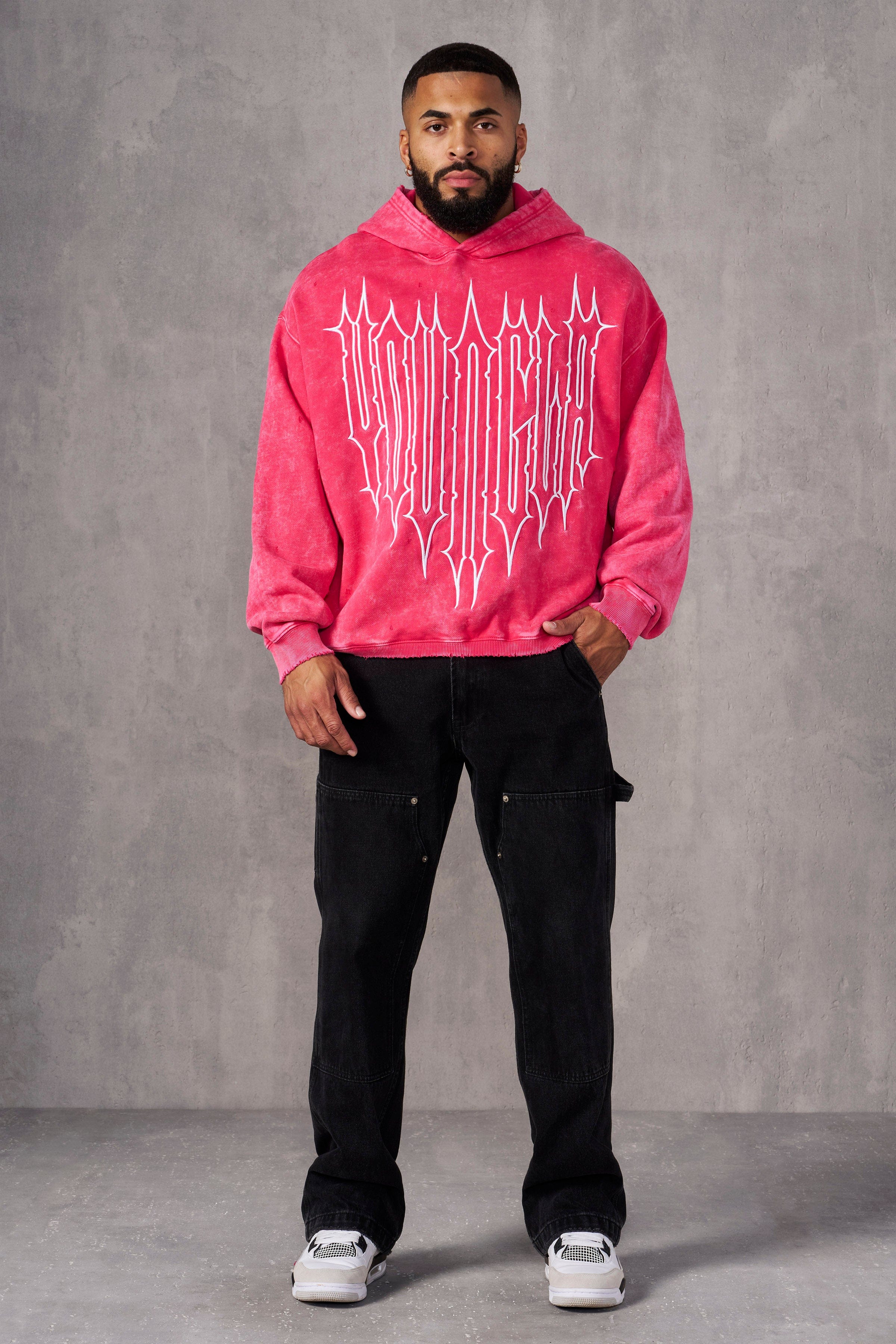 Front view of acid wash oversized hoodie worn casually outdoors