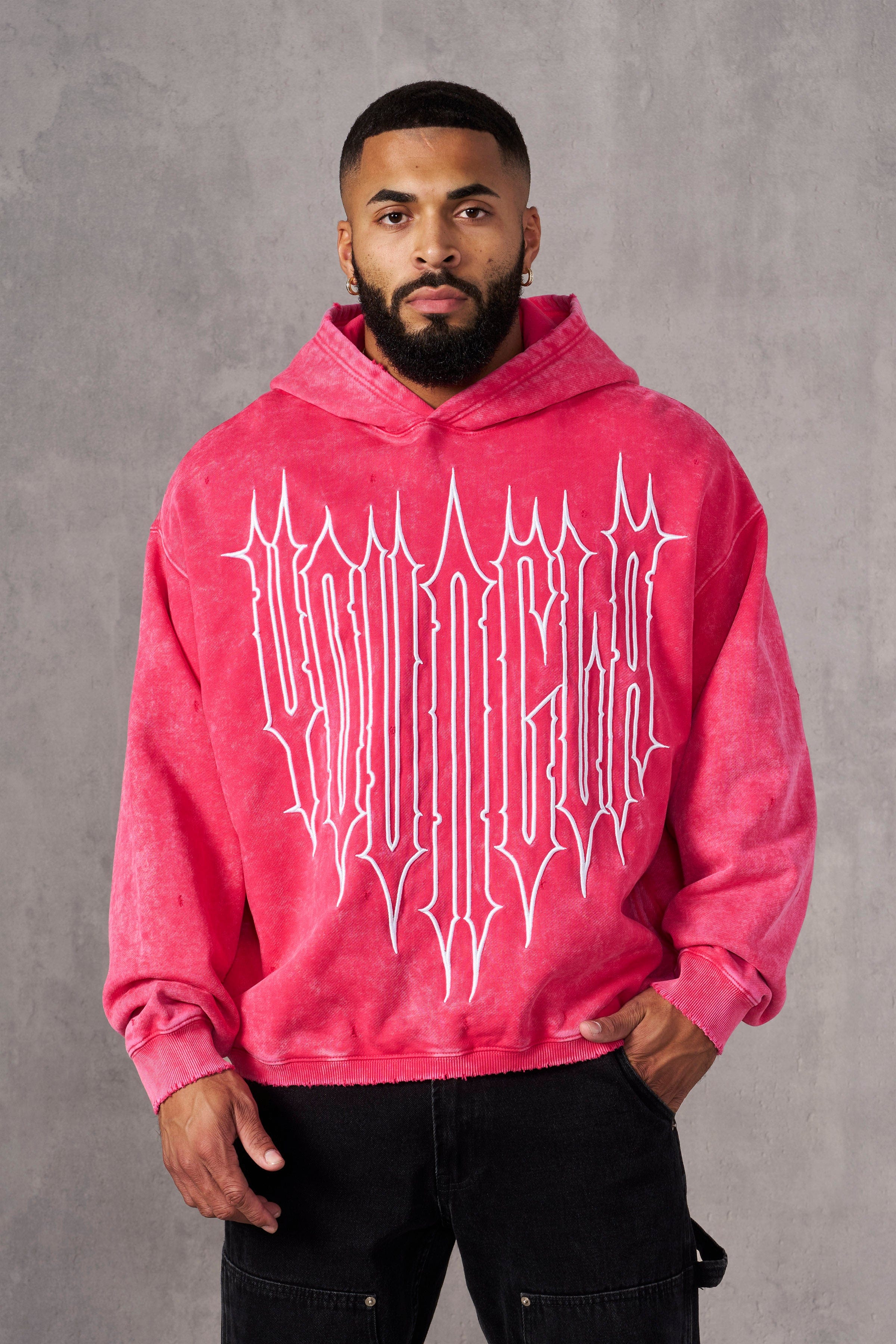 Front view of acid wash oversized hoodie worn casually outdoors