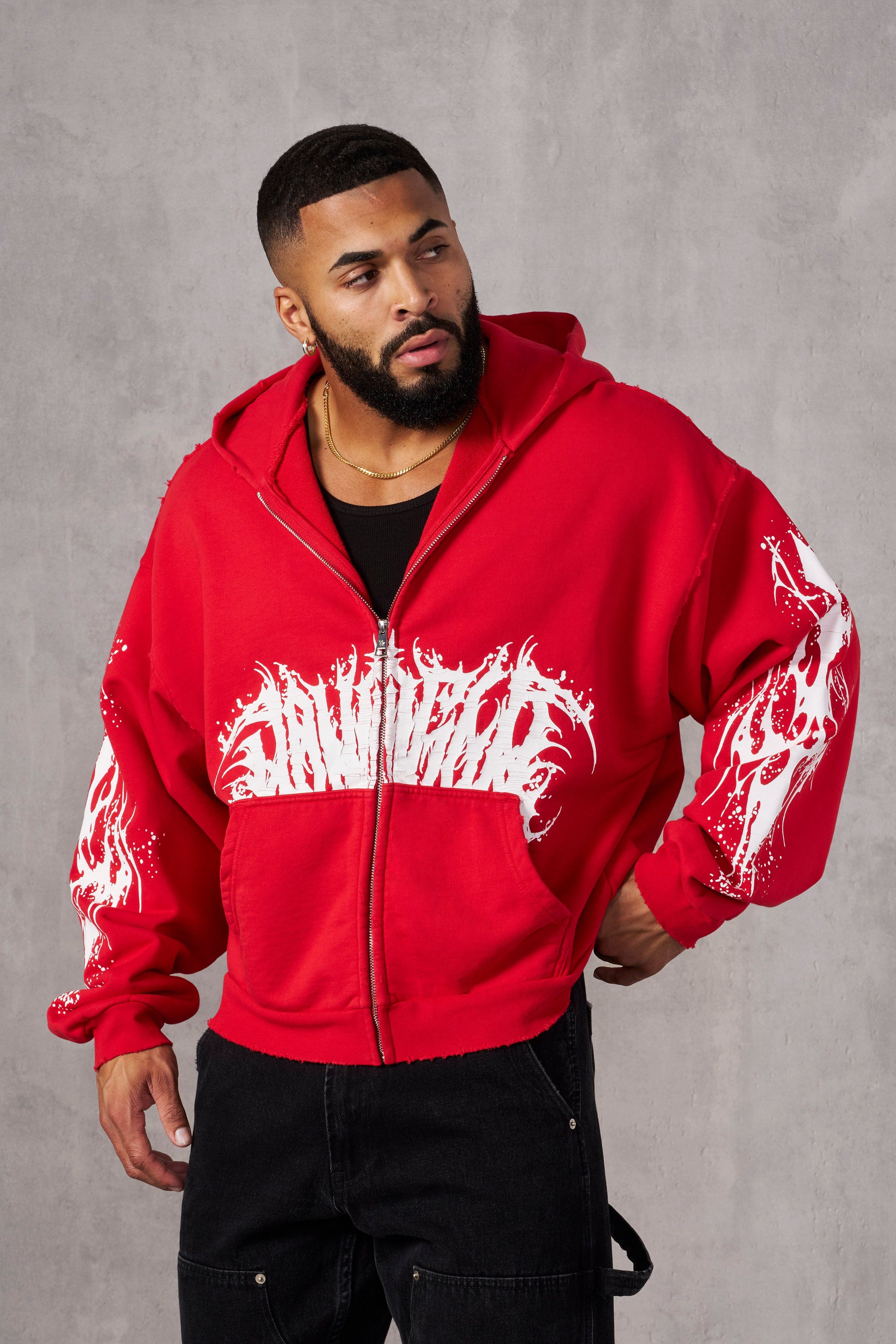 Close-up of tribal graphics on the sleeve of the Venom hoodie, highlighting detailed design and crackle print