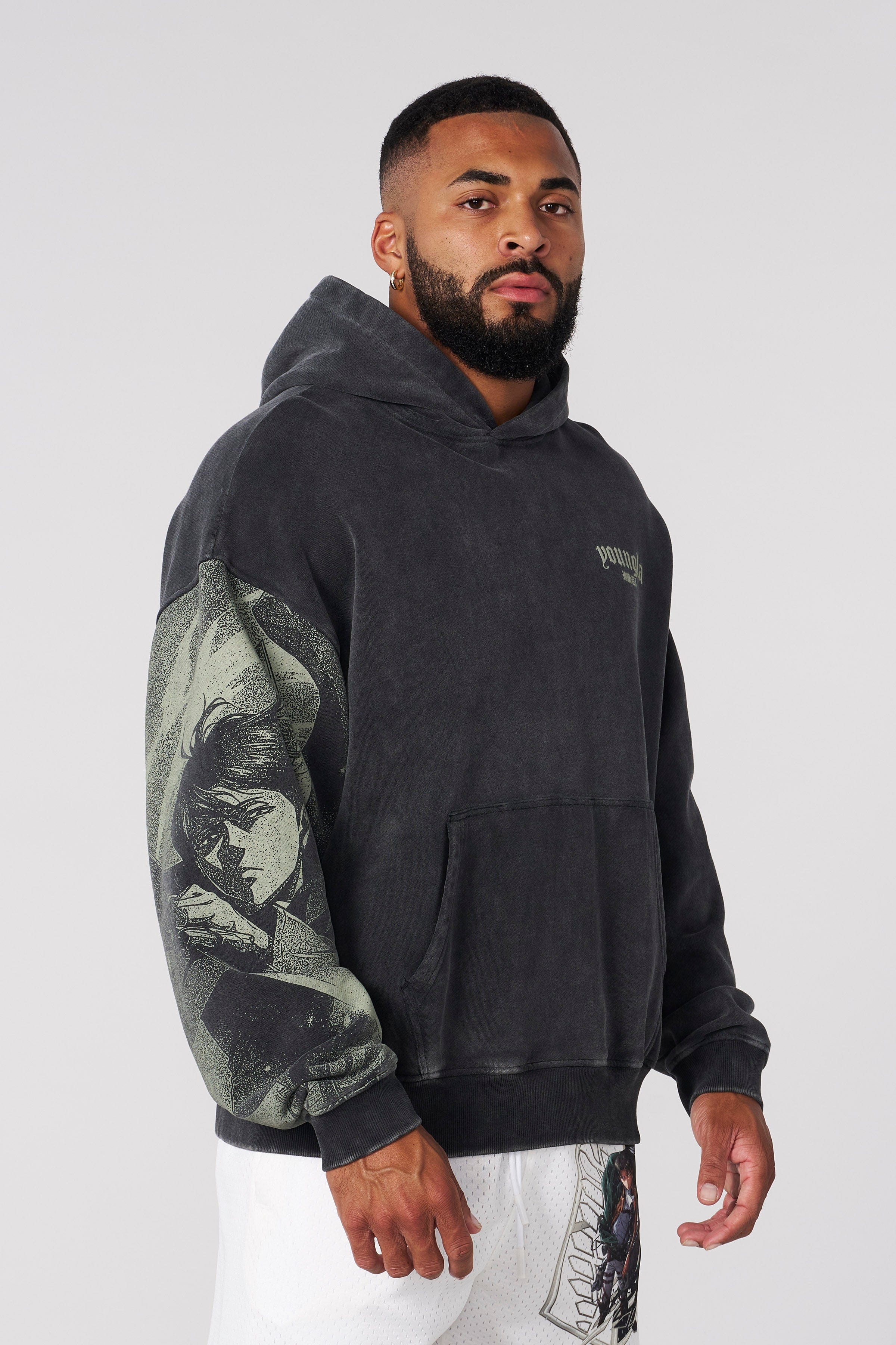 Model wearing the AOT pullover hoodie, showcasing relaxed fit.