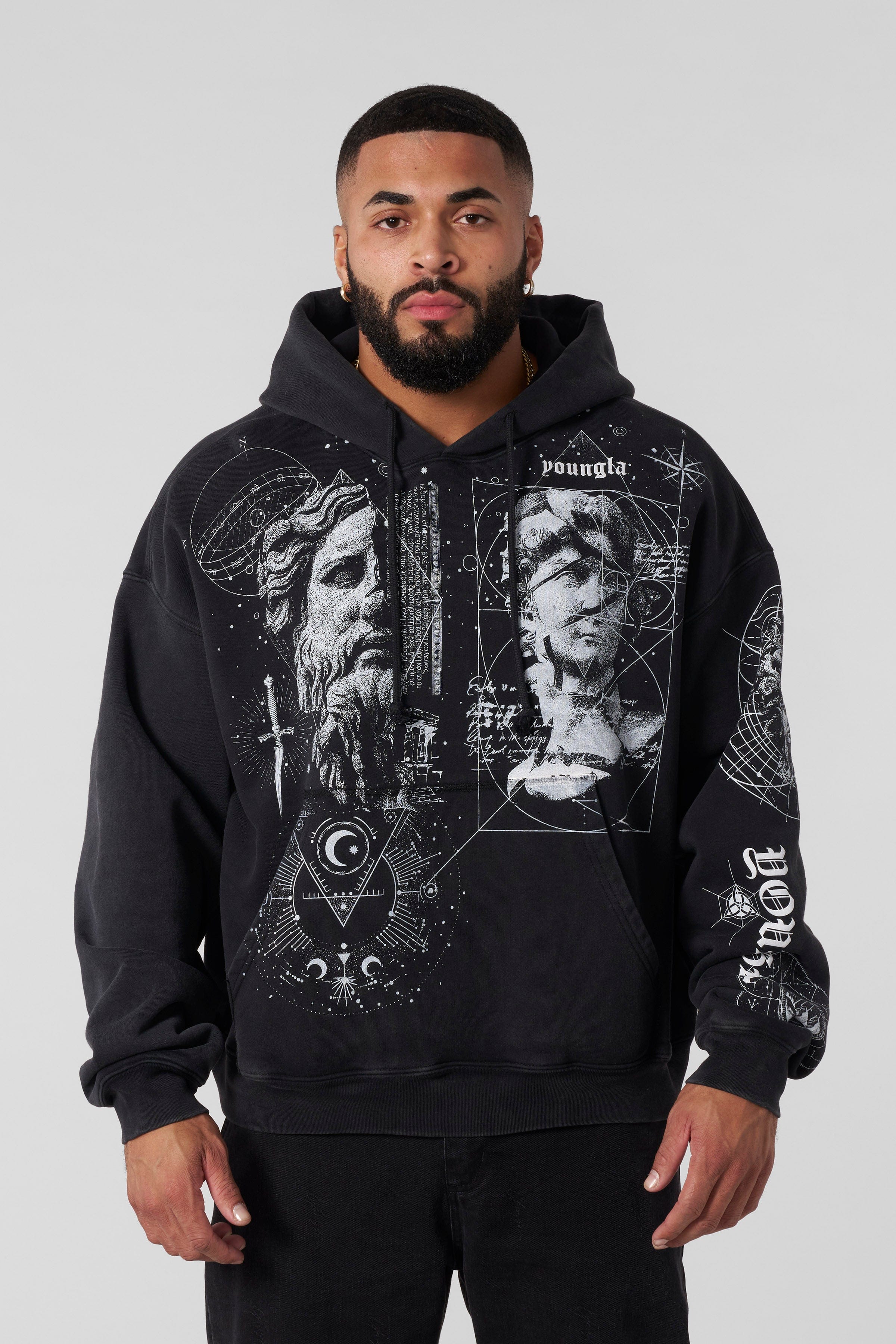 Front view of Renaissance hoodie with intricate tattoo artwork on black cotton fabric