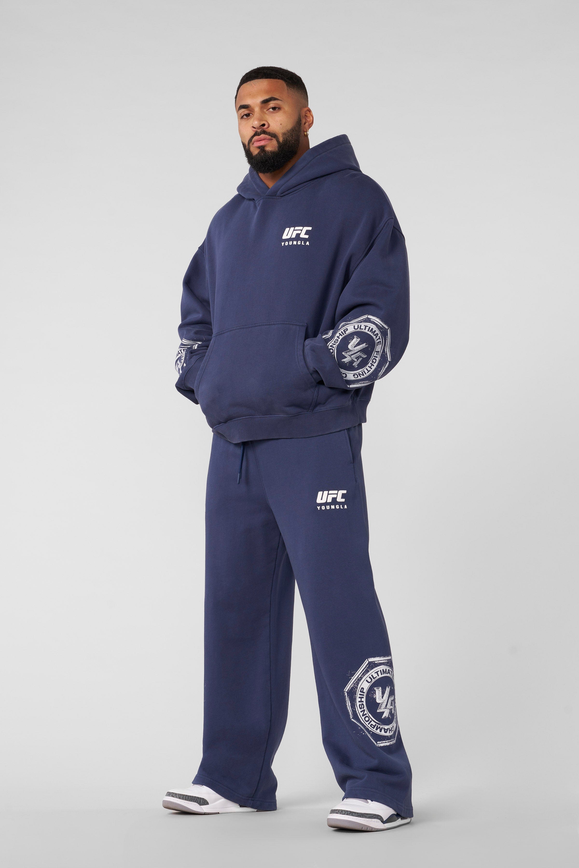 Front view of UFC oversized hoodie showcasing distressed logos.