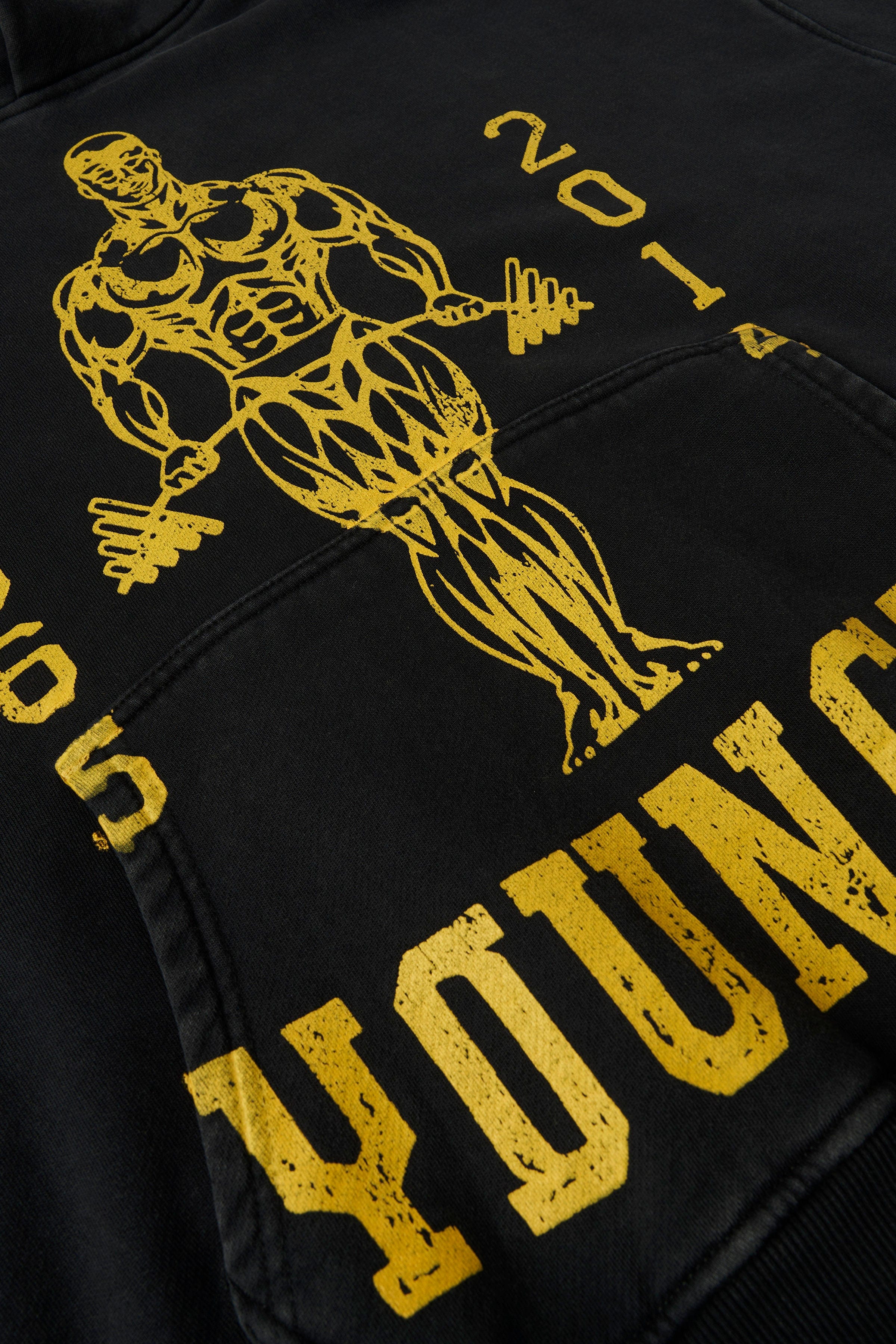 Front view of oversized hoodie showing distressed Golds Gym graphic