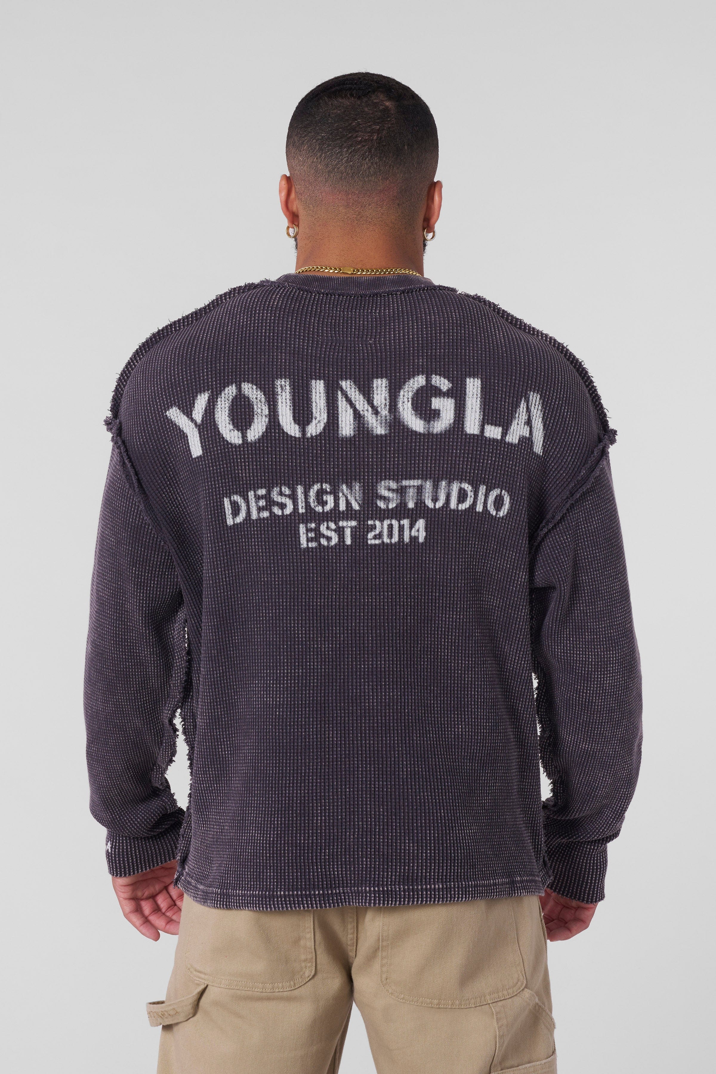 Side angle showing raw seams and vintage-inspired fabric wash