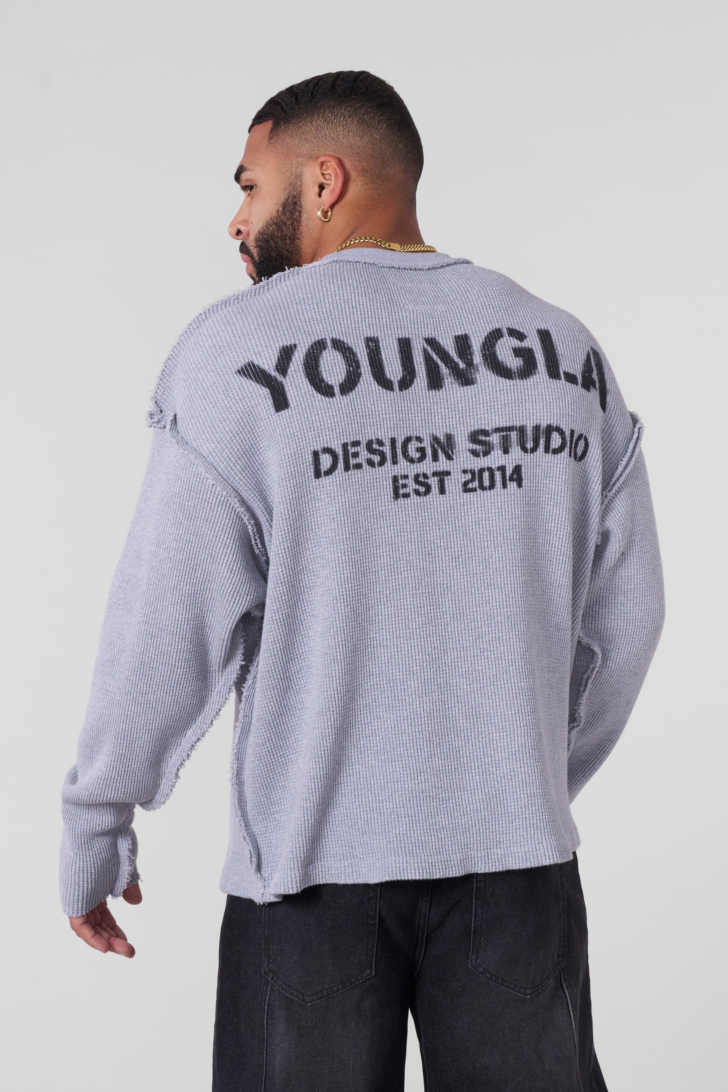 Side angle showing raw seams and vintage-inspired fabric wash