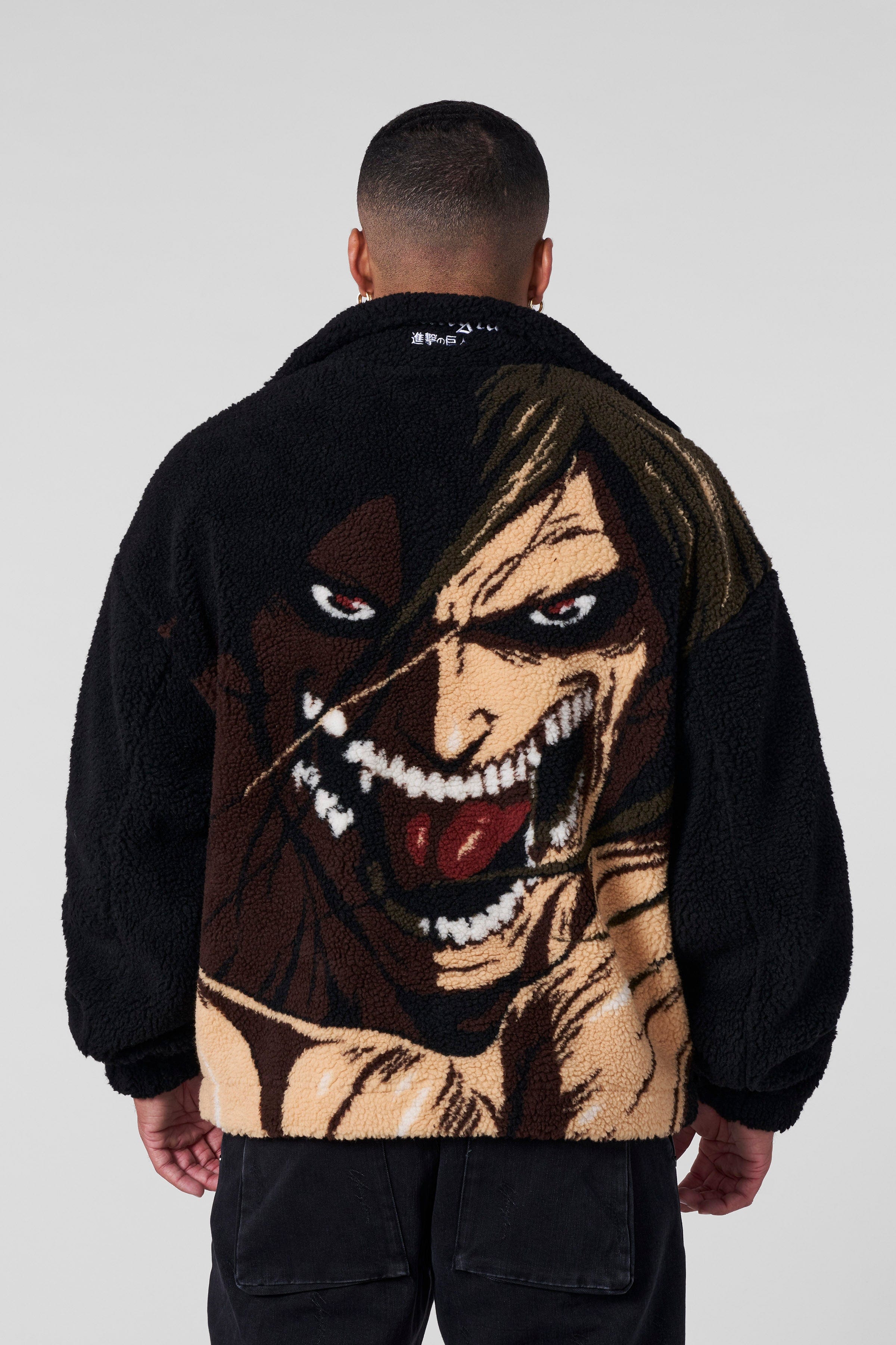 Model wearing the Attack on Titan Sherpa Jacket, showcasing the loose fit and back graphic.