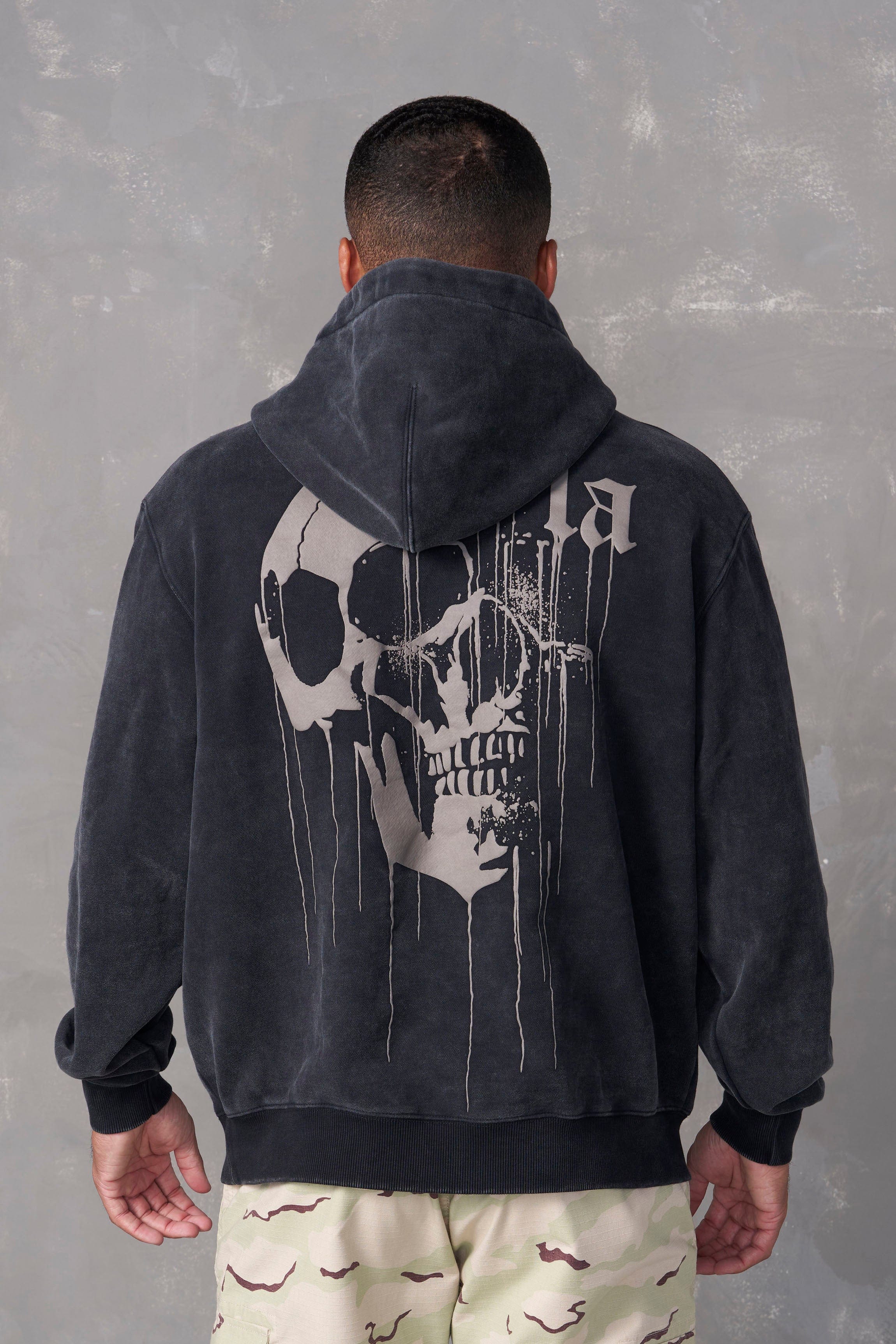 Front view of Urban Drippy Skull Graphic Hoodie highlighting the unique skull print.