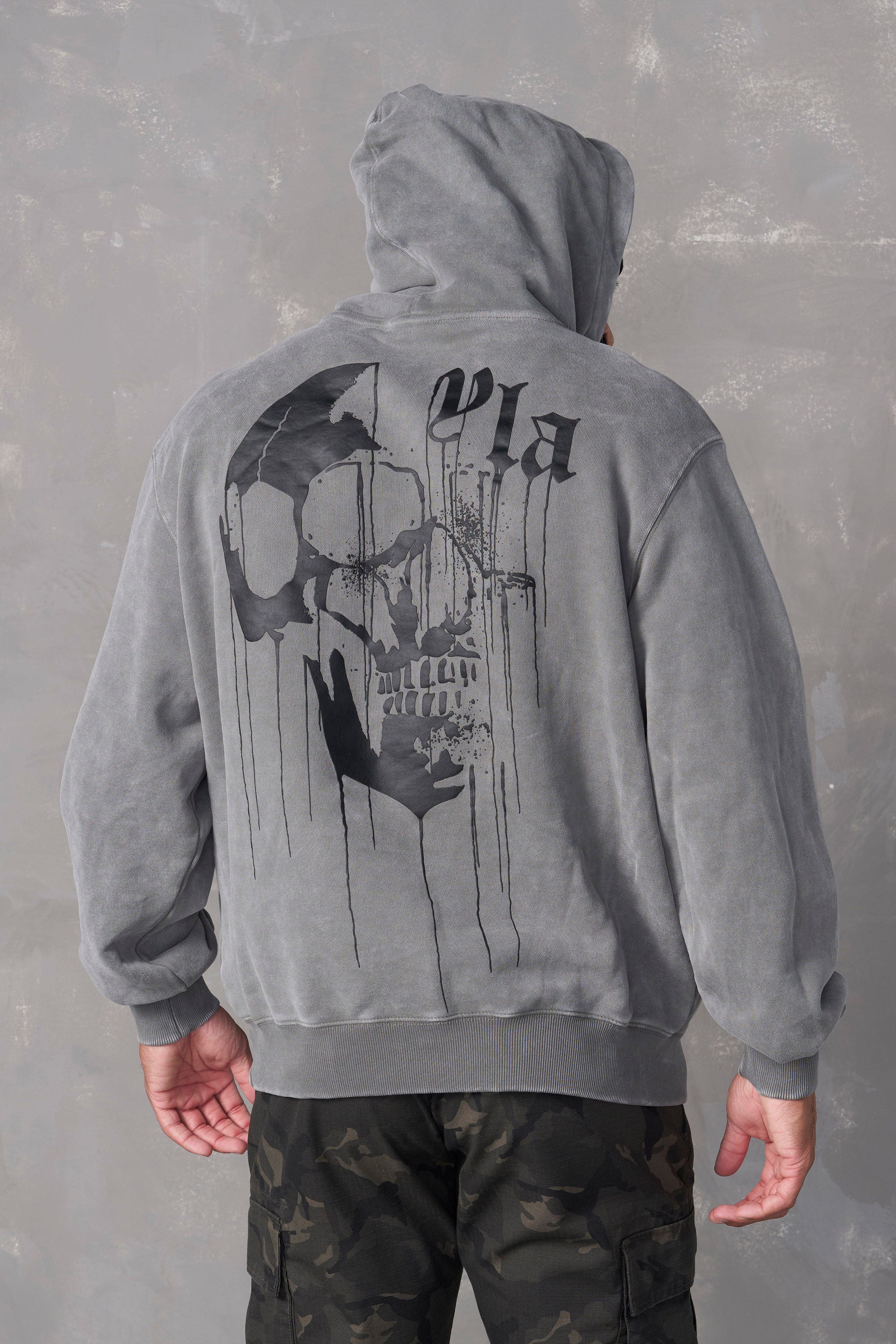 Side angle of the hoodie demonstrating its fit and washed vintage finish.