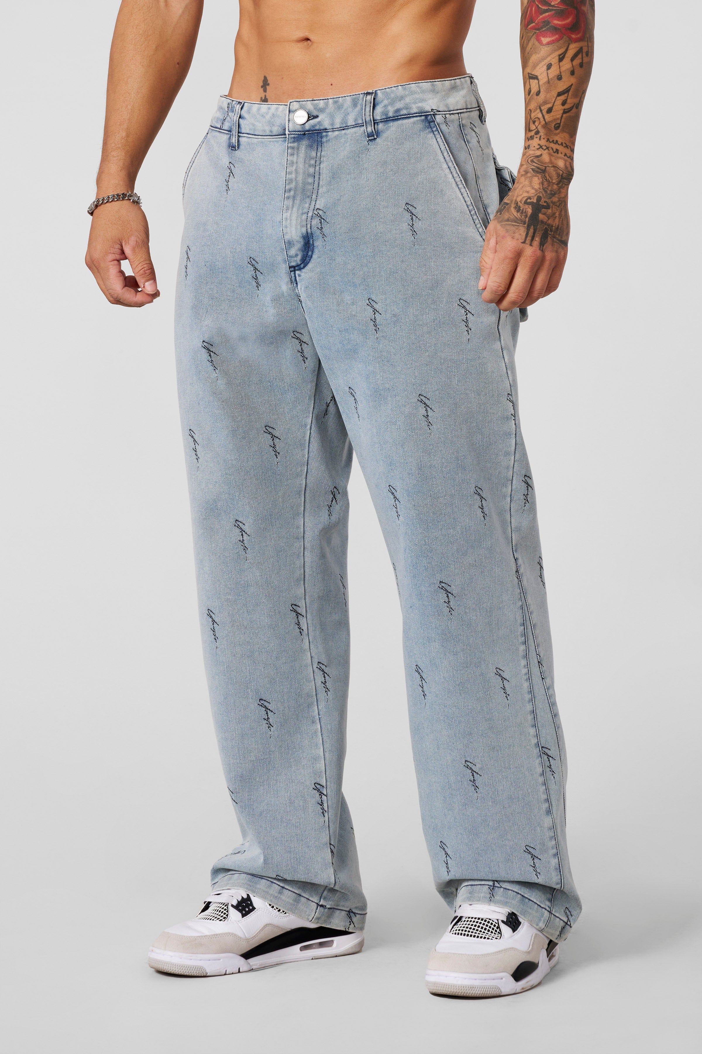 True Religion baggy jeans front view, showcasing logo detailing and relaxed fit.