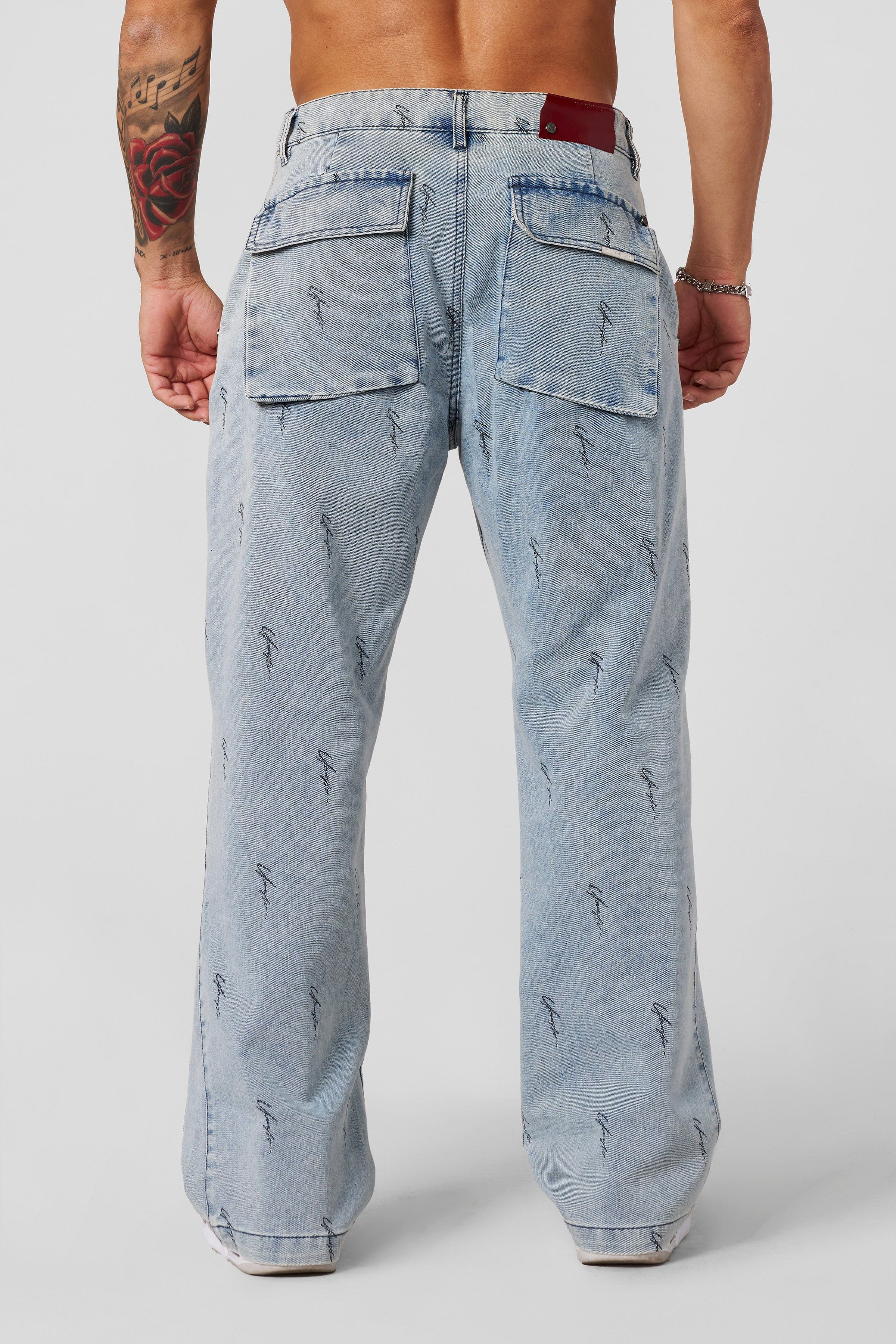 Casual outfit pairing baggy jeans with a white tee for streetwear inspiration.