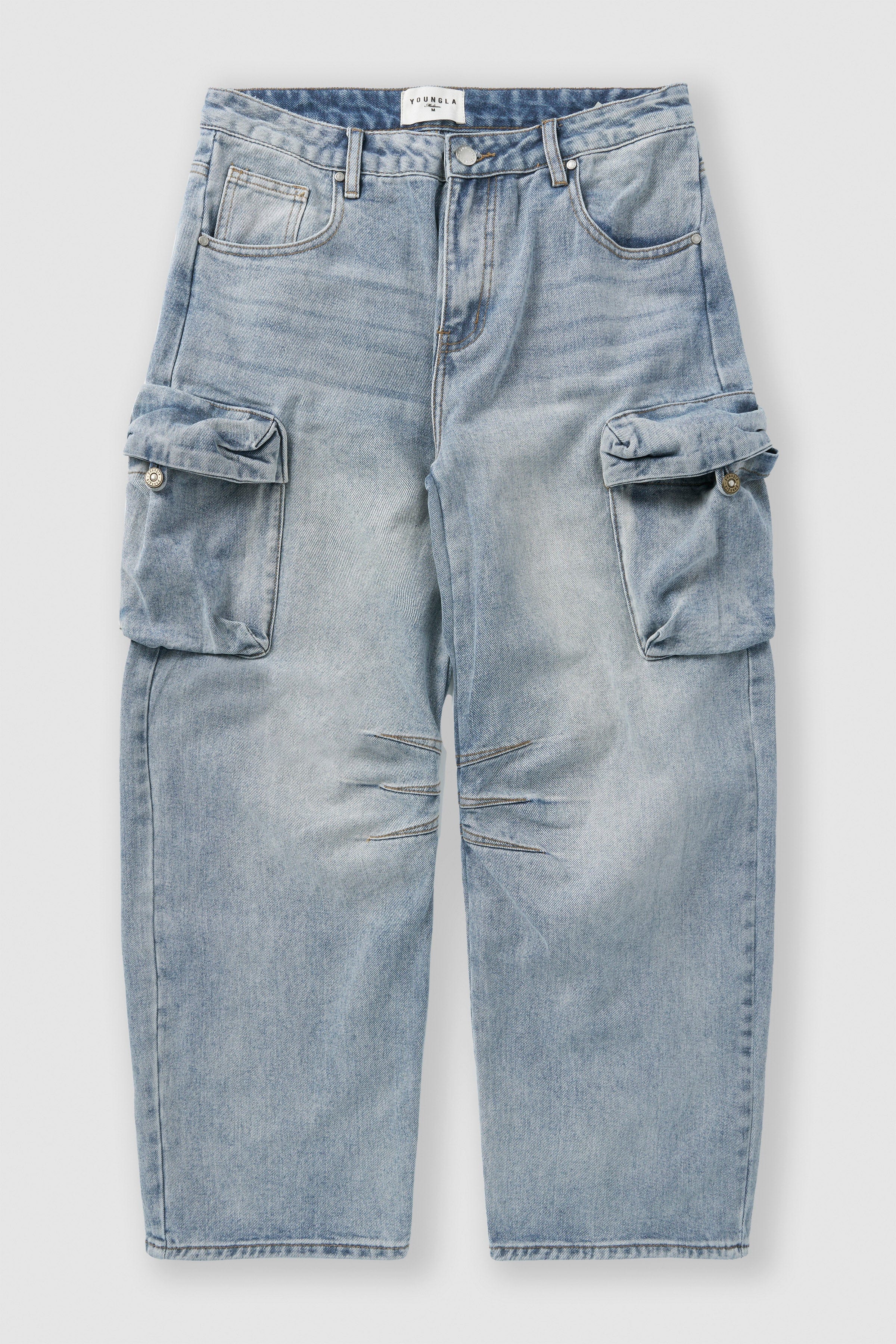 Close-up of fabric texture and fading on baggy cargo jeans for men