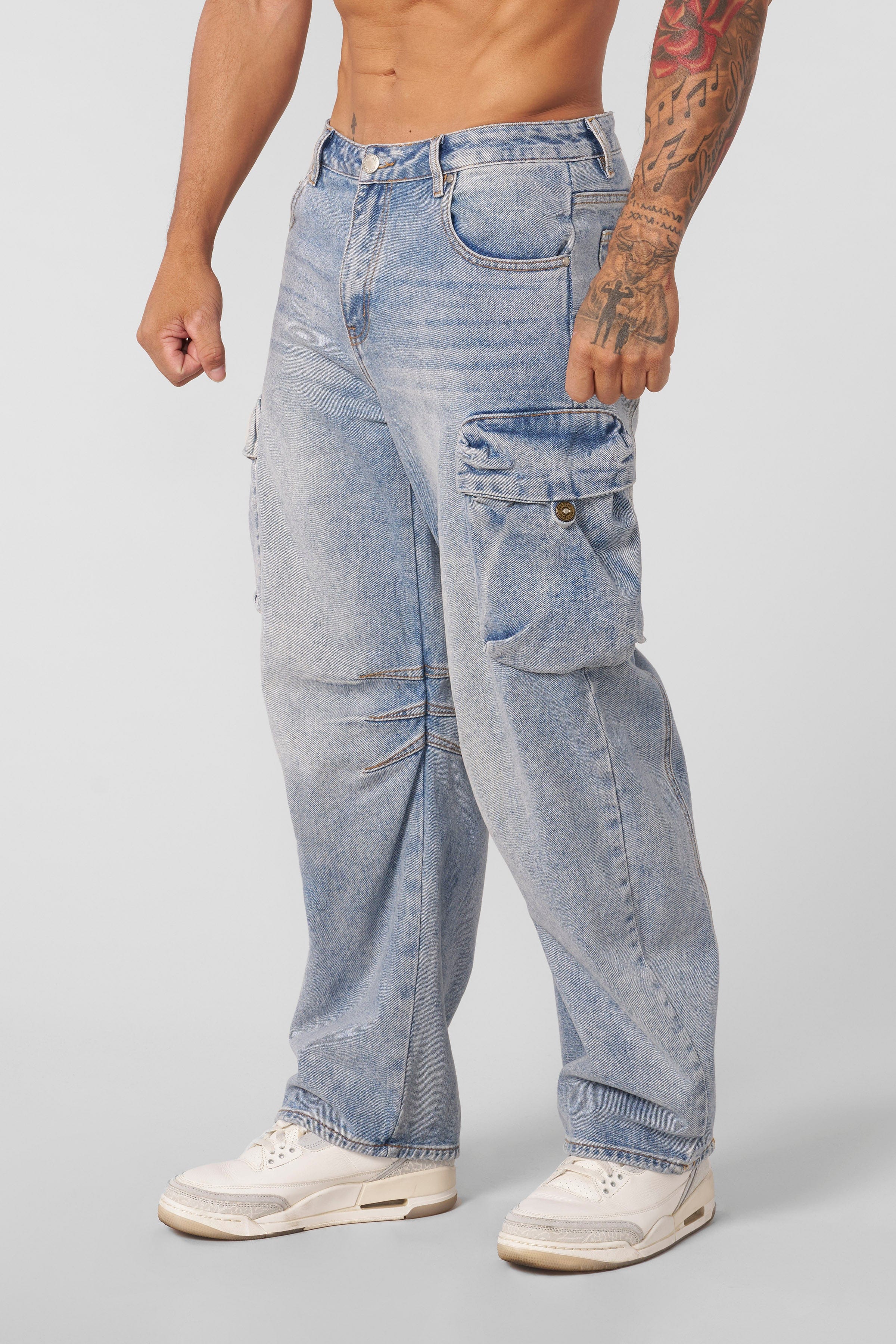 Front view of cargo jeans highlighting large cargo pockets and vintage wash