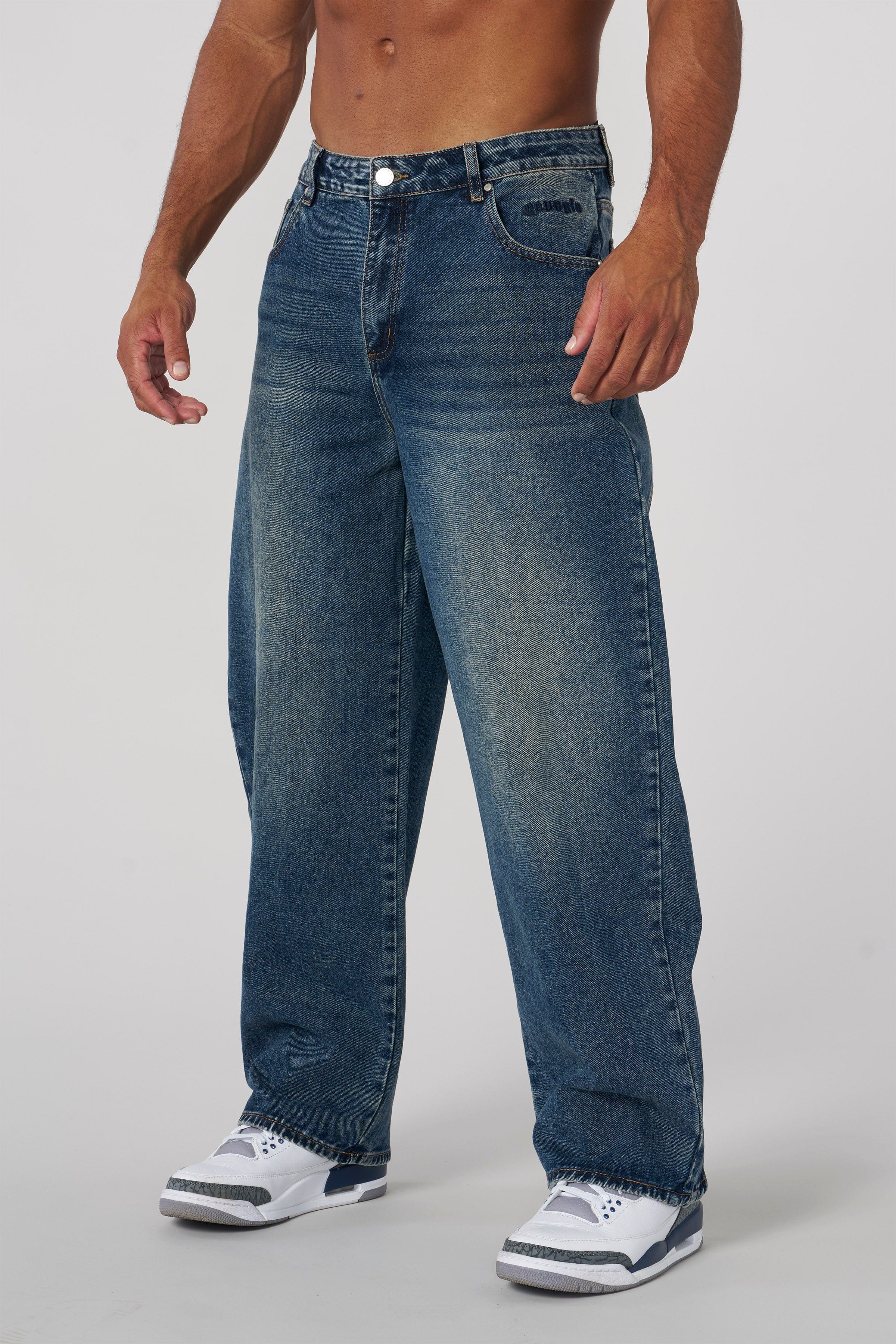 Back shot highlighting streetwear jeans fit and low rise design