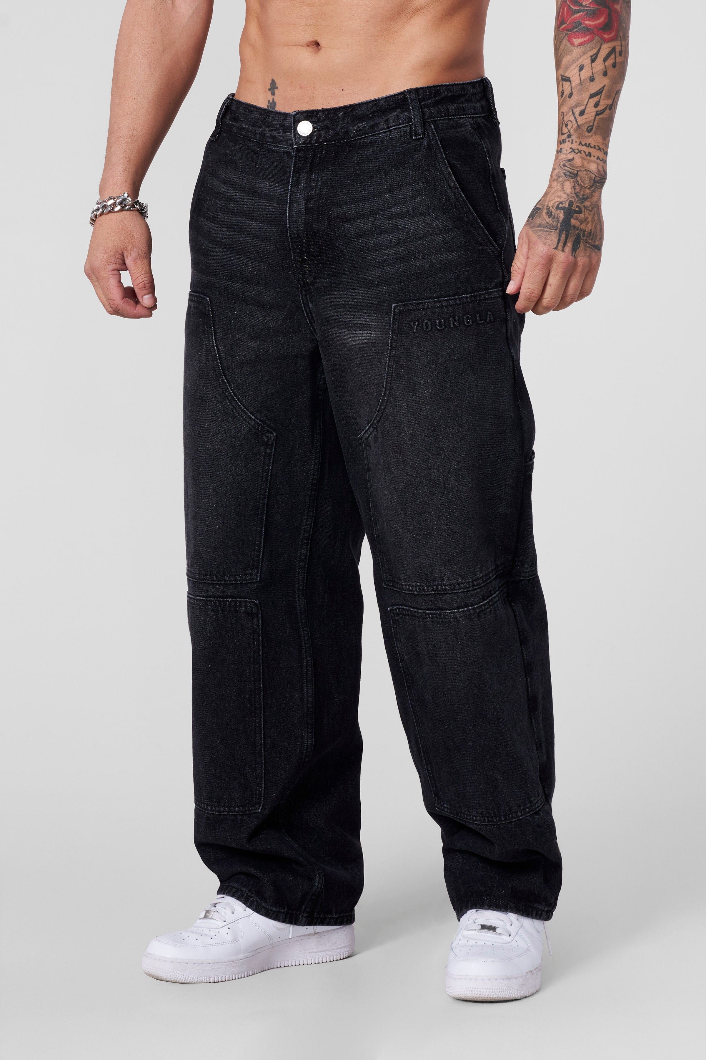 Detail of redone workwear jeans showcasing subtle branding.