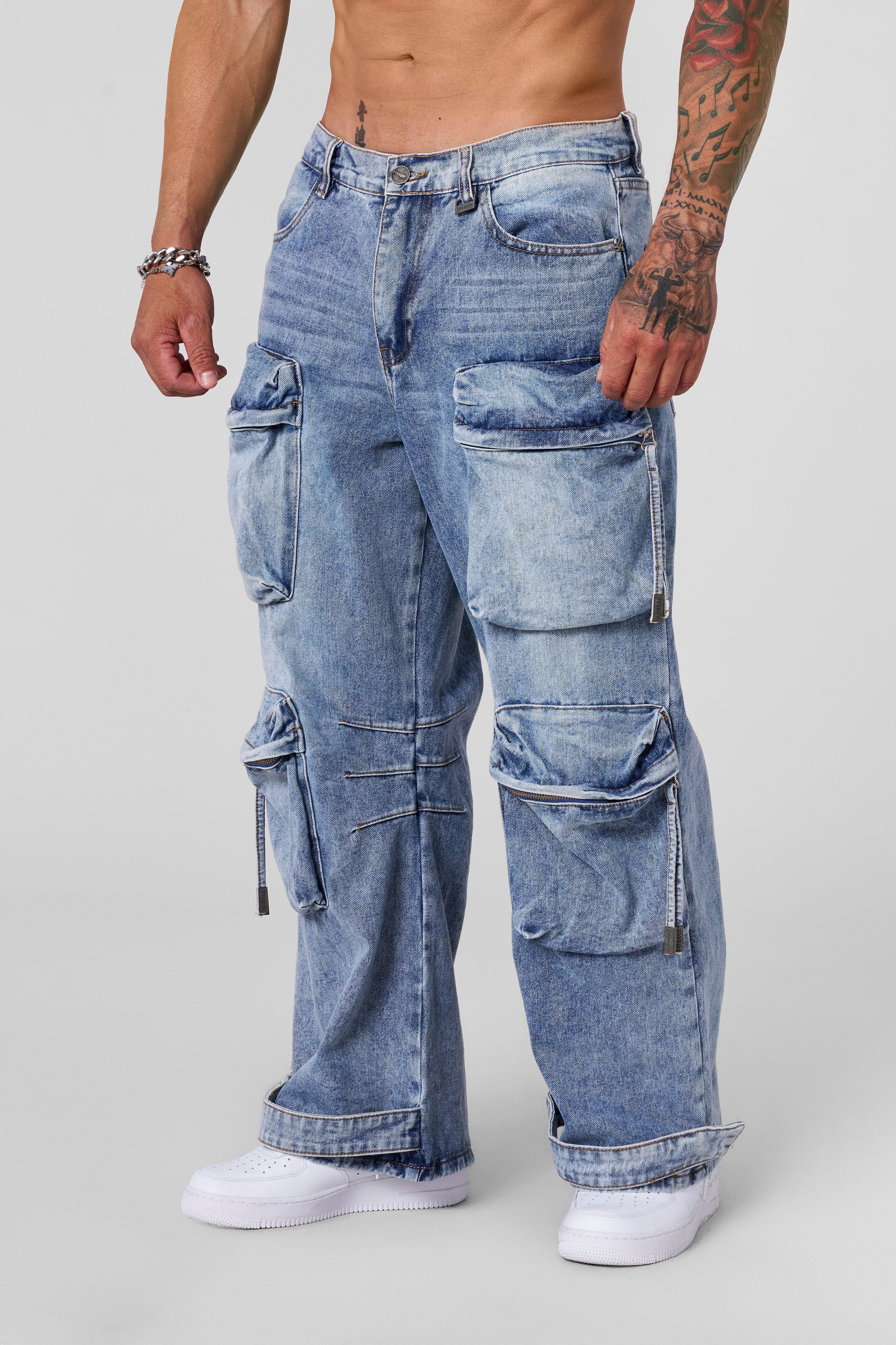 Front angle of baggy jeans with utility pockets styled for city wear