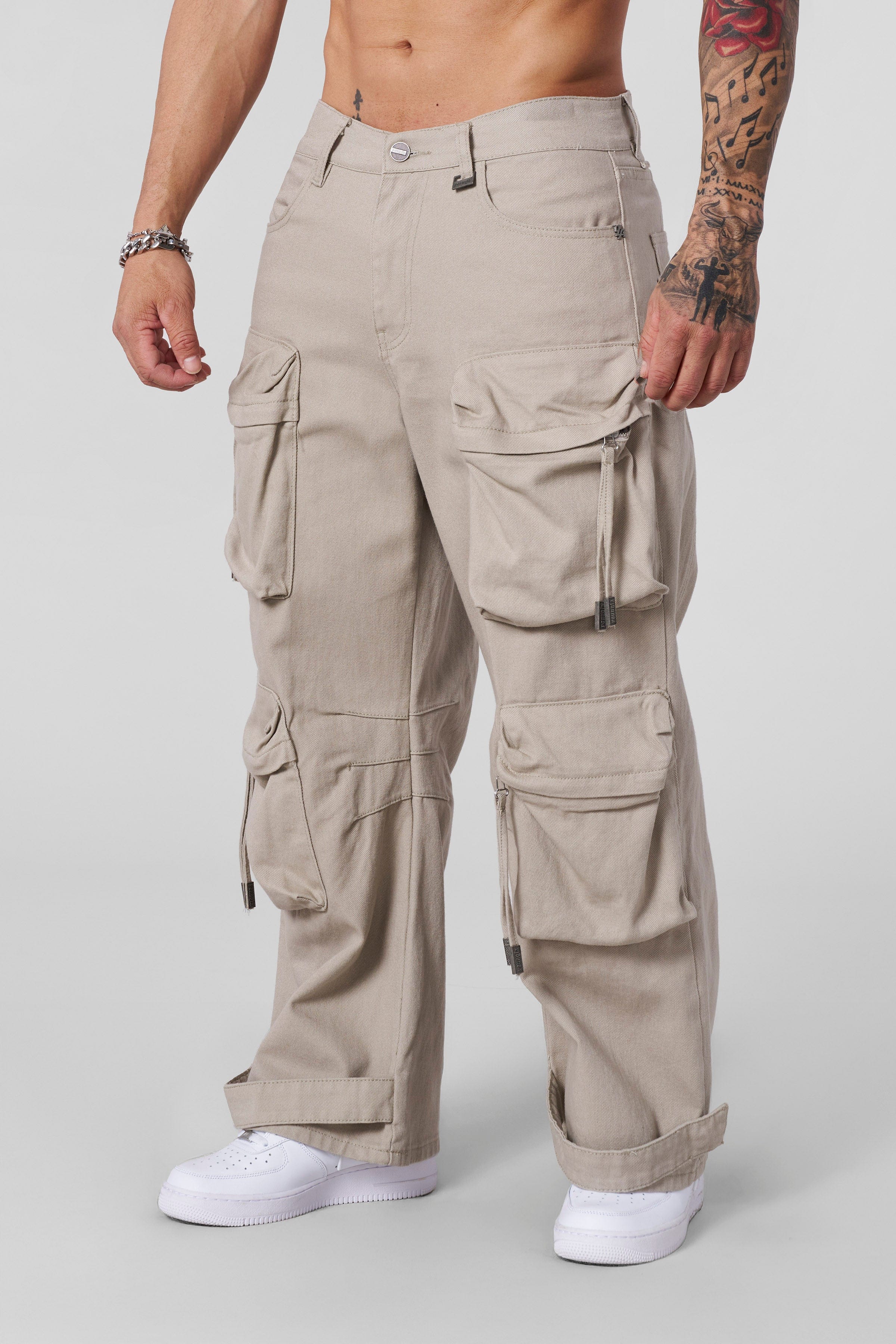 Rear view of cargo pants in denim worn by male model in Brooklyn street scene