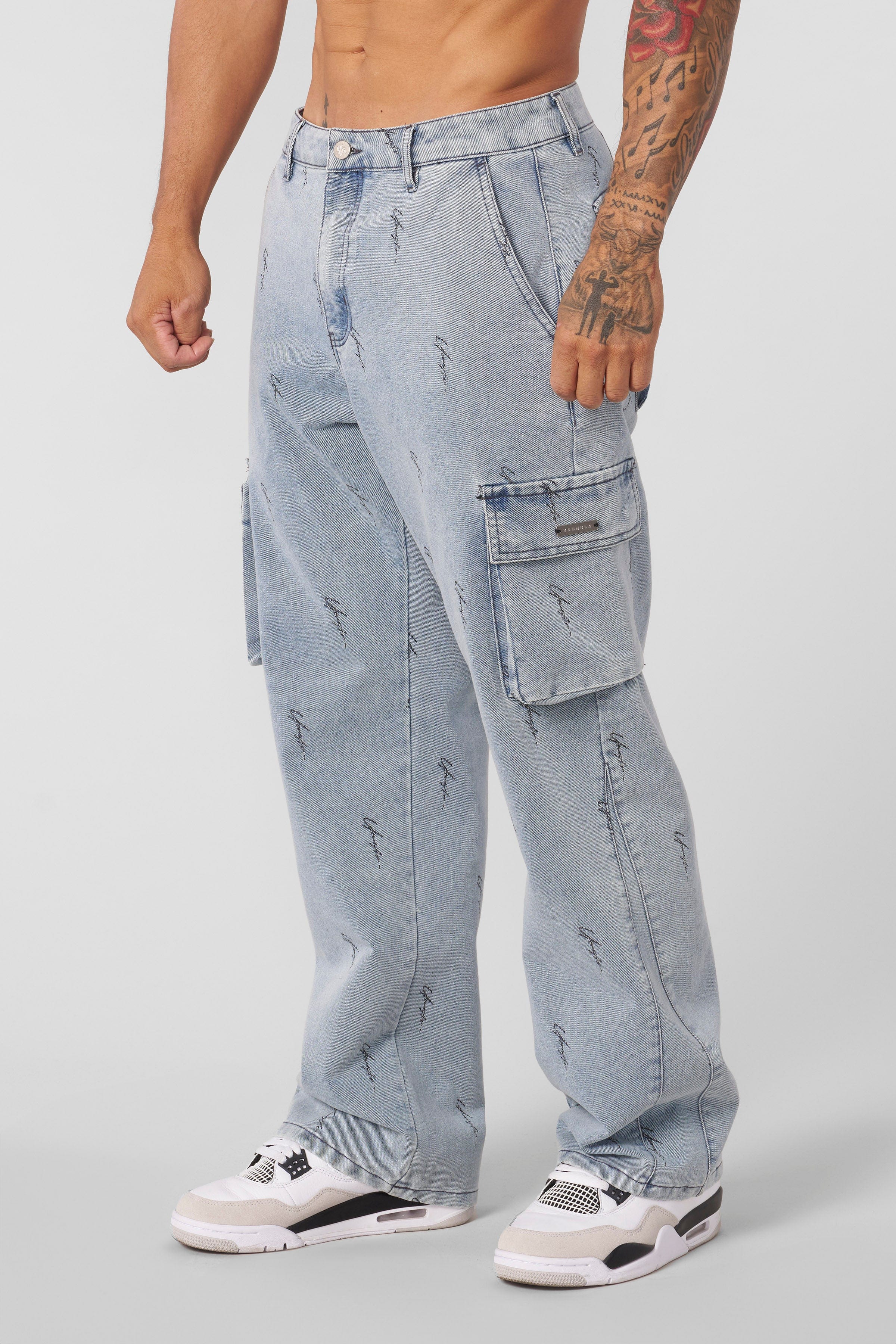 Close-up of cargo trouser jeans detailing metal tag and jacquard pattern