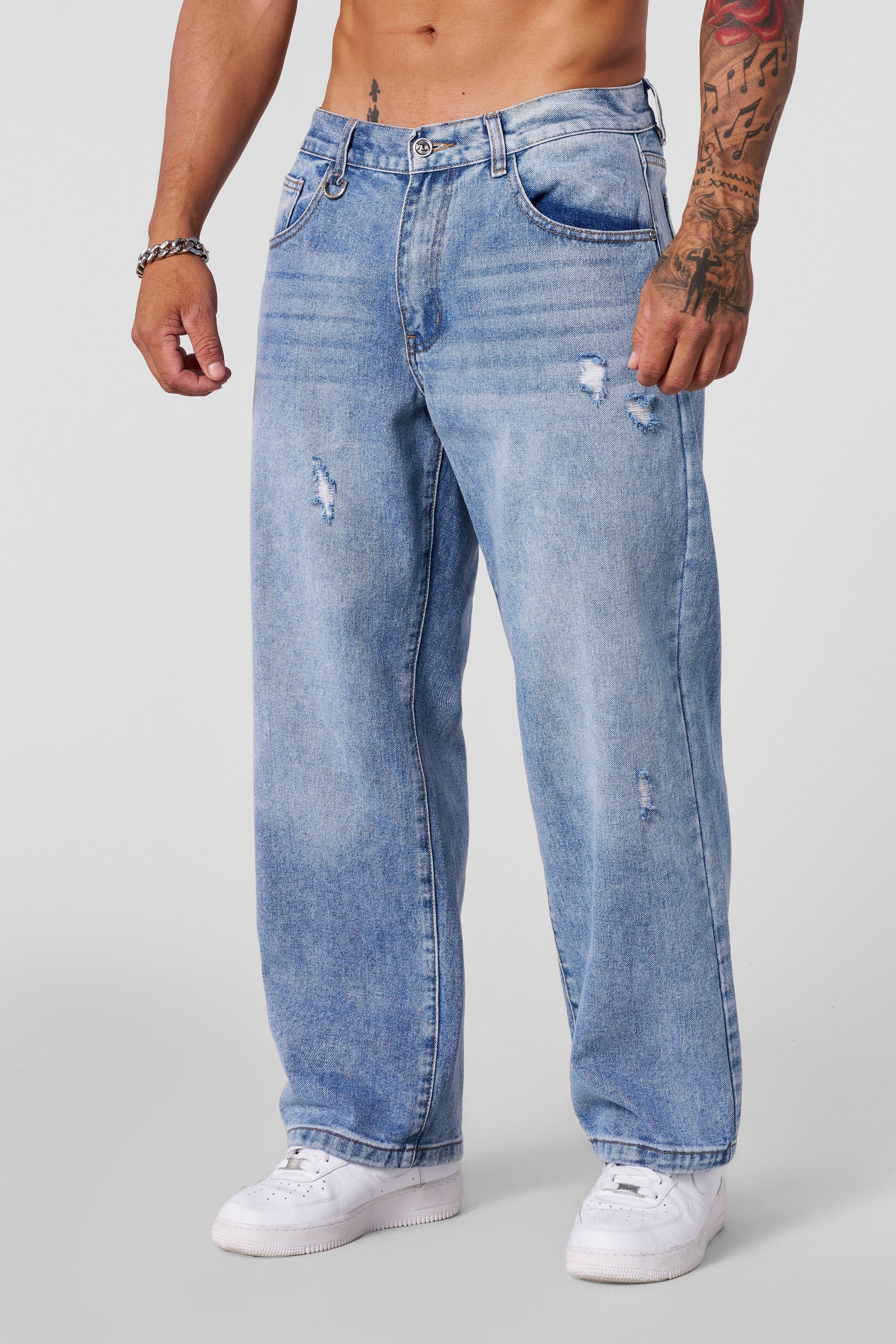 Essential loose fit jeans on model, showcasing 90s-inspired baggy silhouette