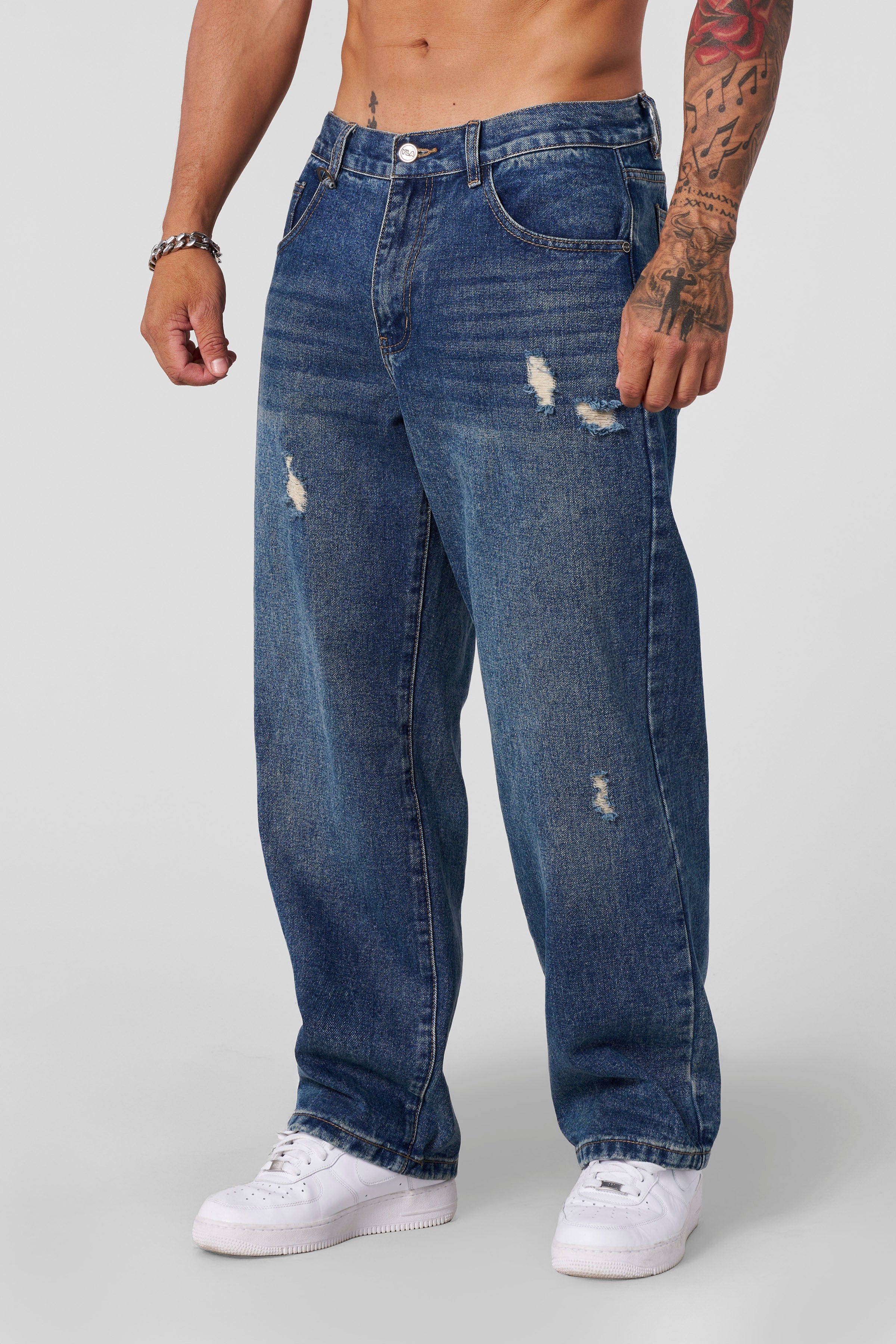 Essential loose fit jeans on model, showcasing 90s-inspired baggy silhouette