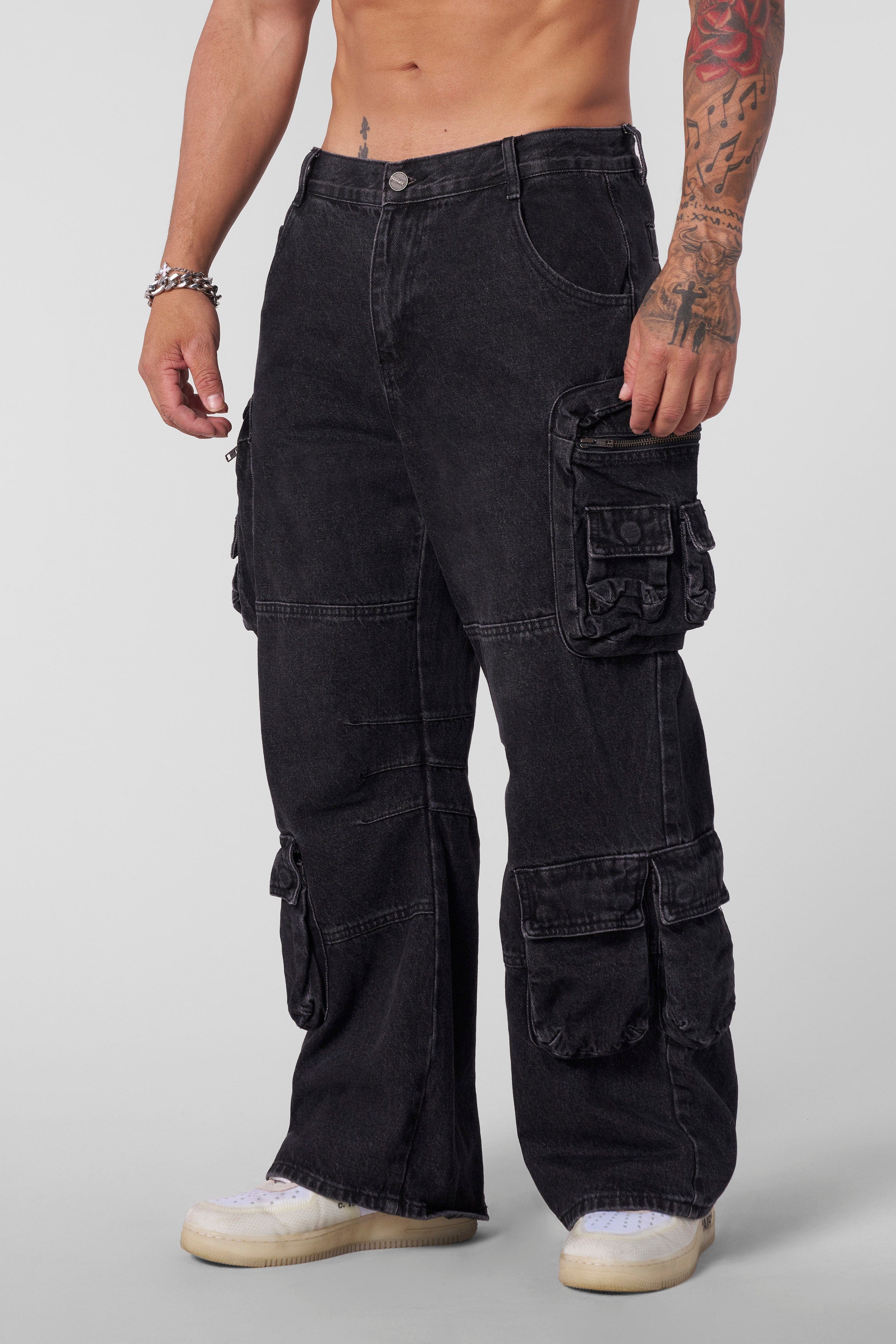 Front view of urban utility stacked jeans for men with cargo pockets.