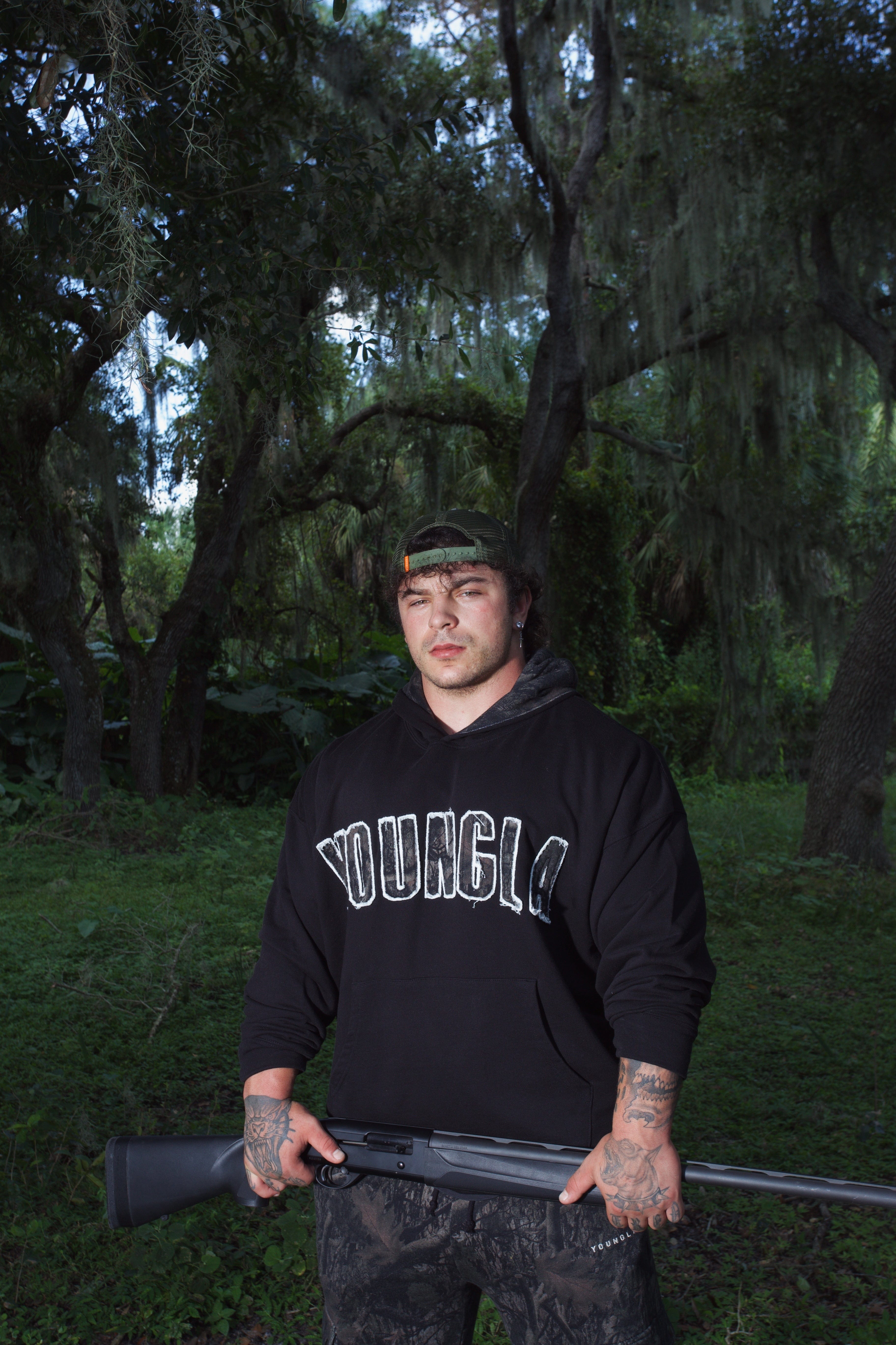 Close-up of the collegiate logo on the oversized hoodie.