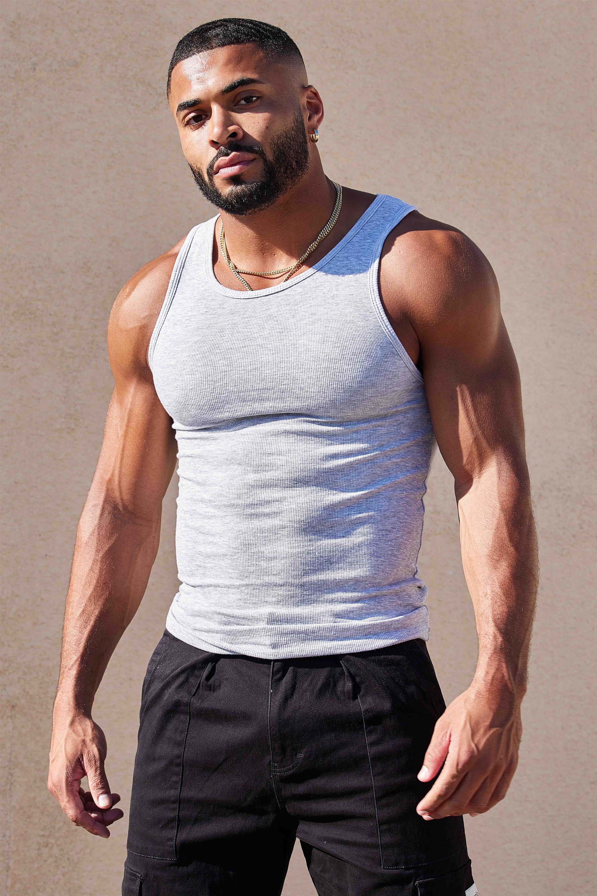Side angle of compression shirts in oatmeal and heather grey on hanger