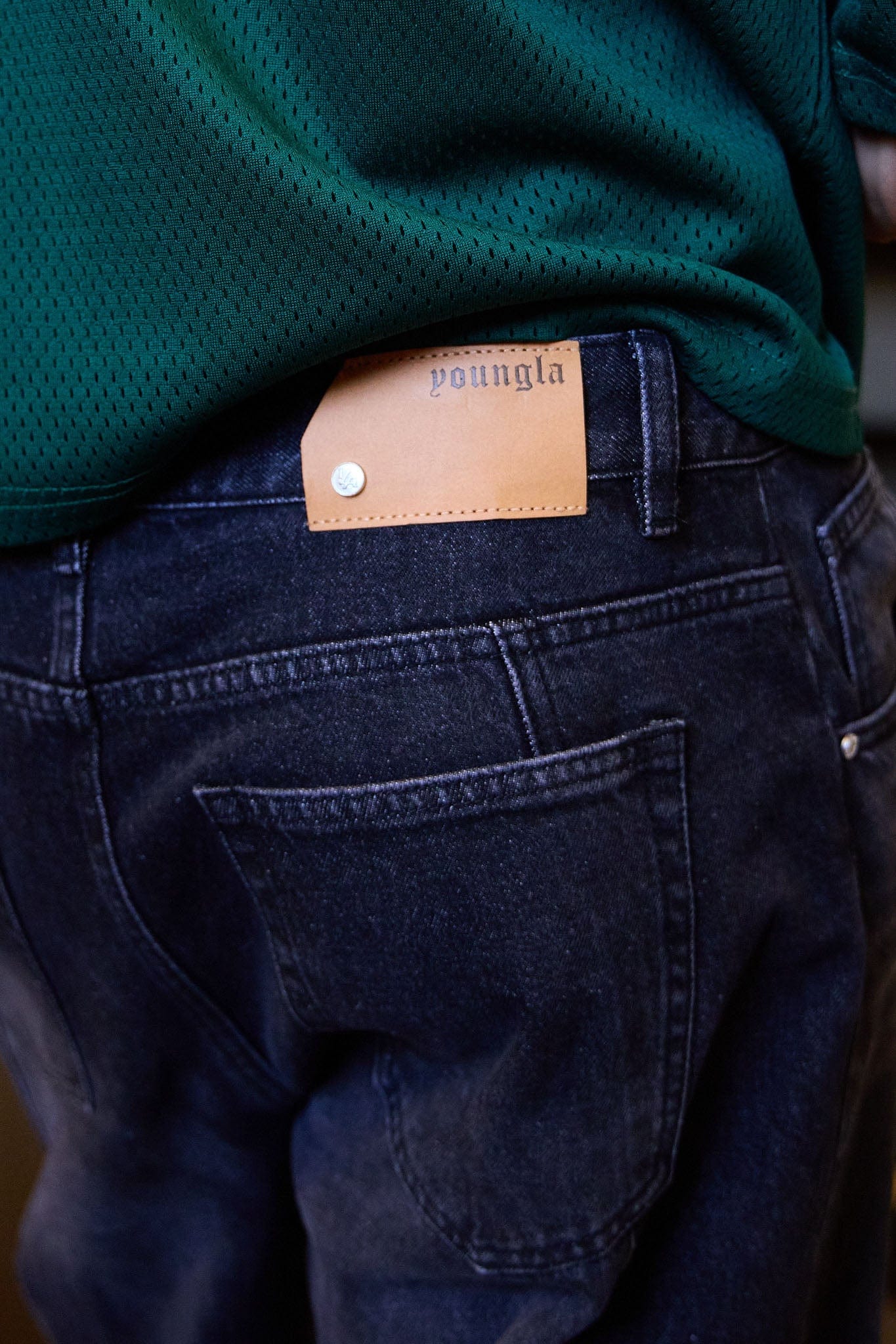 Back shot highlighting streetwear jeans fit and low rise design