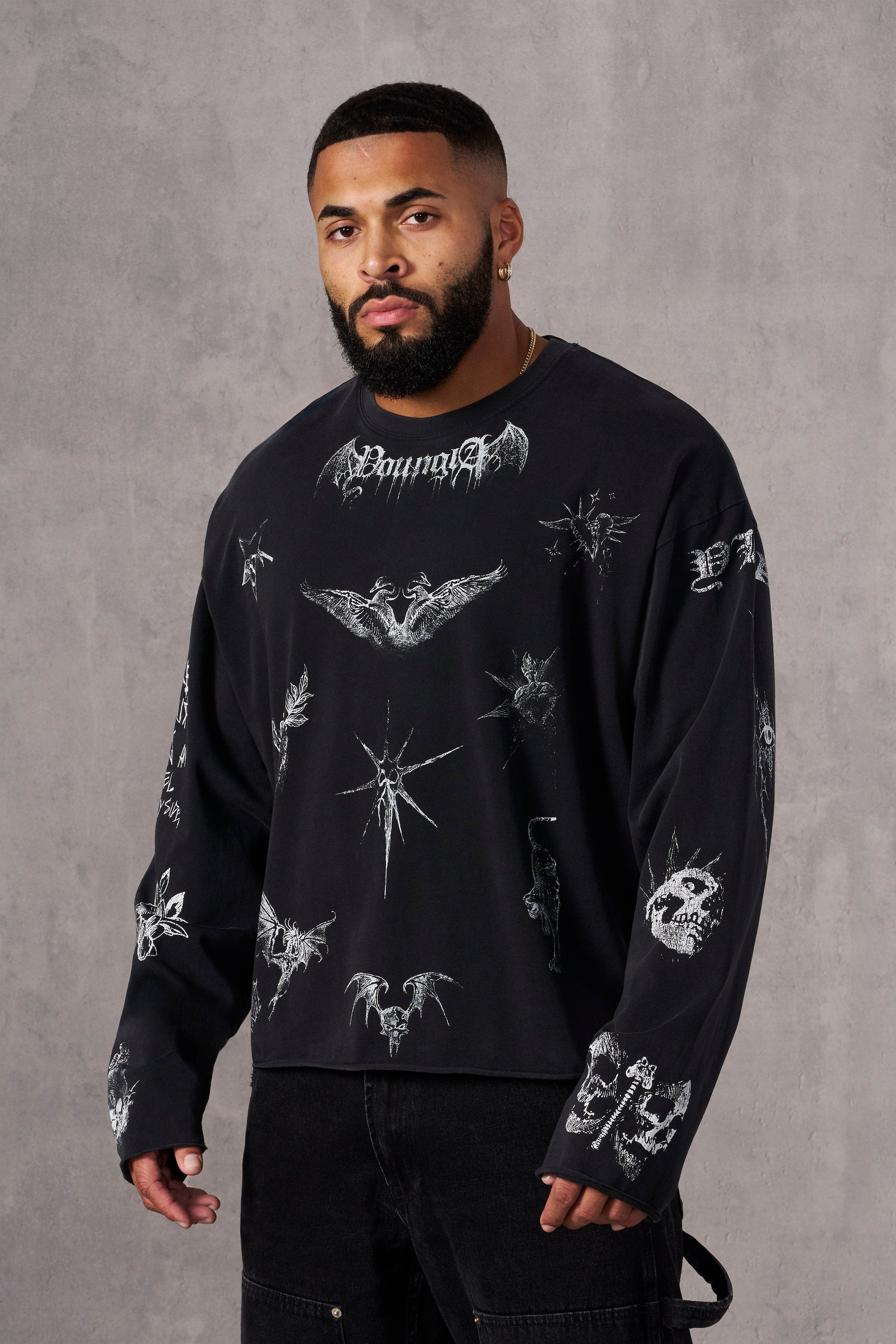 Close-up of sketchy long sleeve graphic shirts on cotton fabric