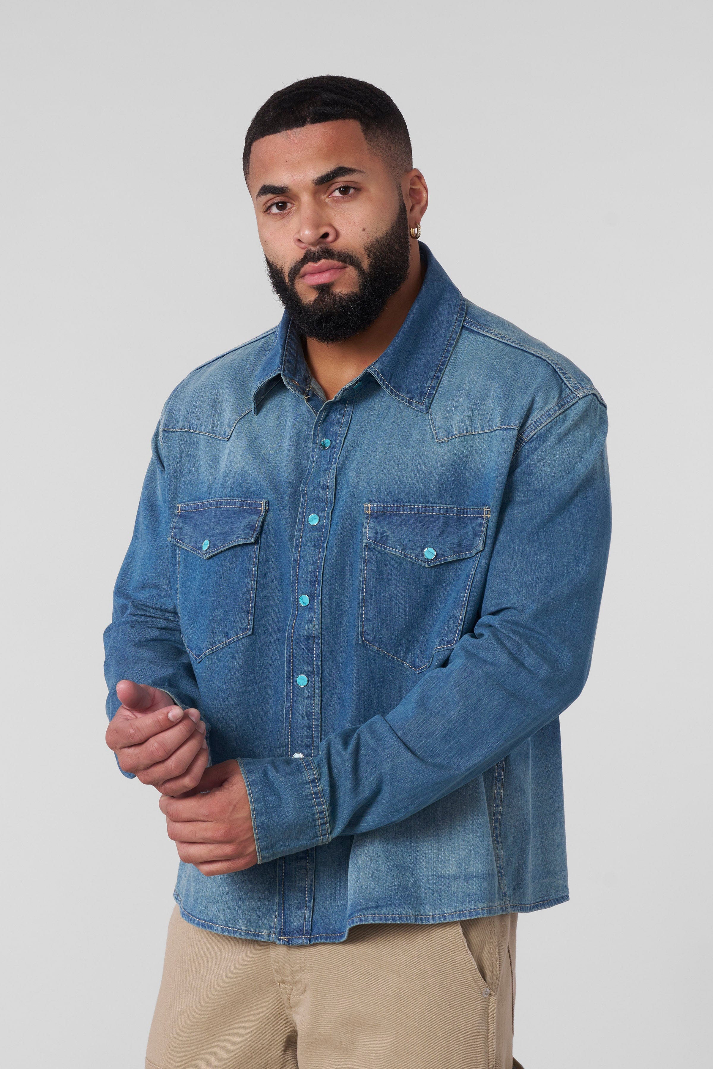Model wearing the western denim shirt in a casual setting.